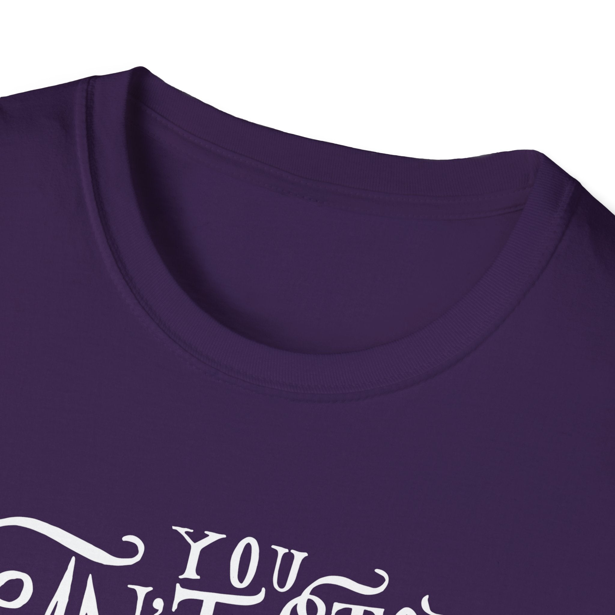 Close-up of the Can't Stop Surfing T-Shirt in purple, adorned with partial white text in a decorative font, showcasing a vintage-inspired design that embodies the passion of surfing enthusiasts.