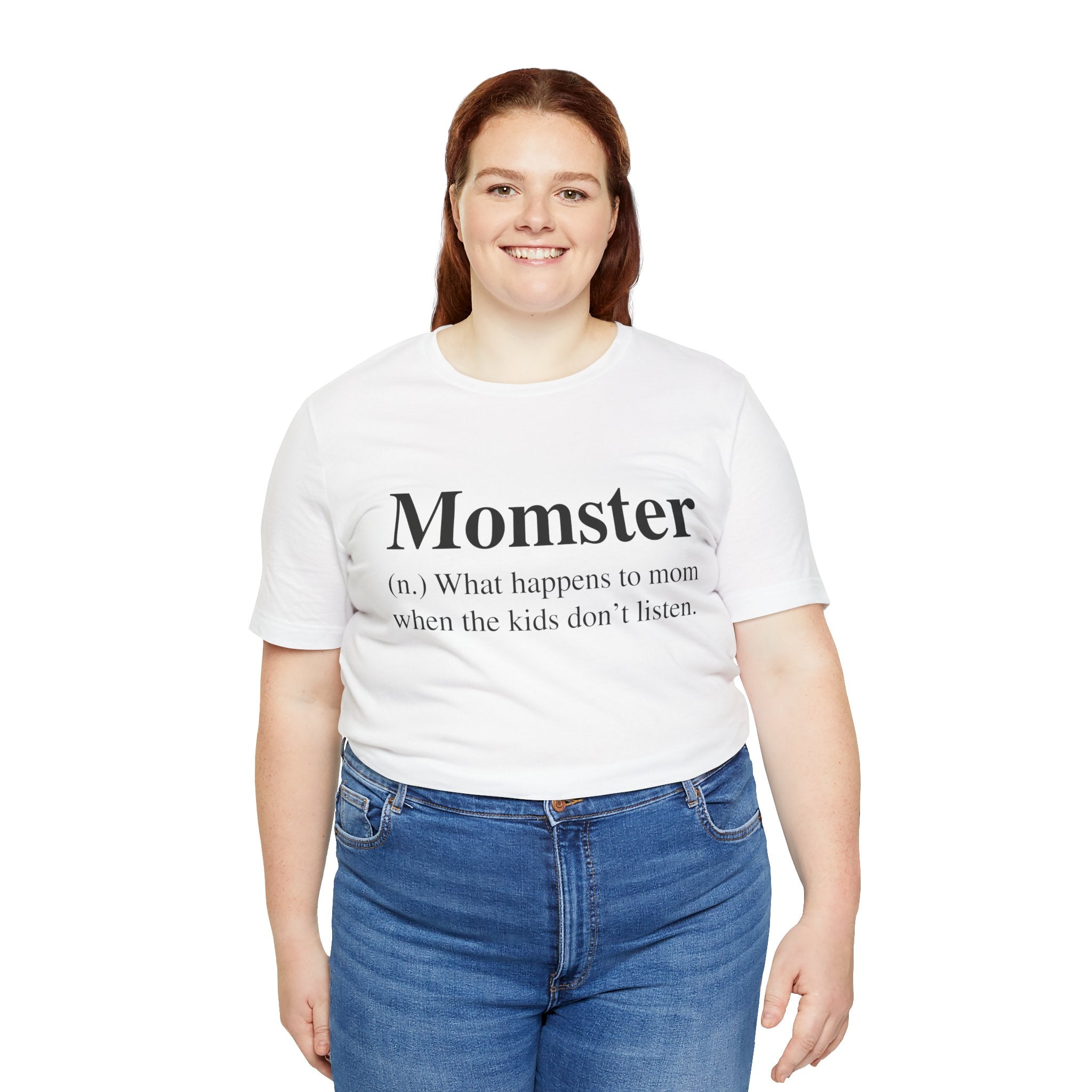 A woman smiling in a Momster T-Shirt, paired with blue jeans.