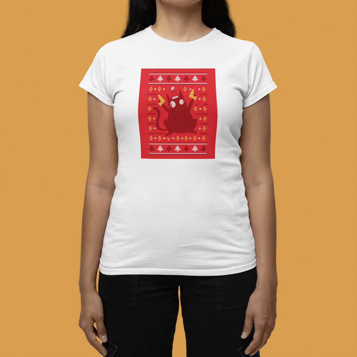 Ugly Sweater Cat Women's T-Shirt in white, woman modeling it against an orange backdrop, cat gift