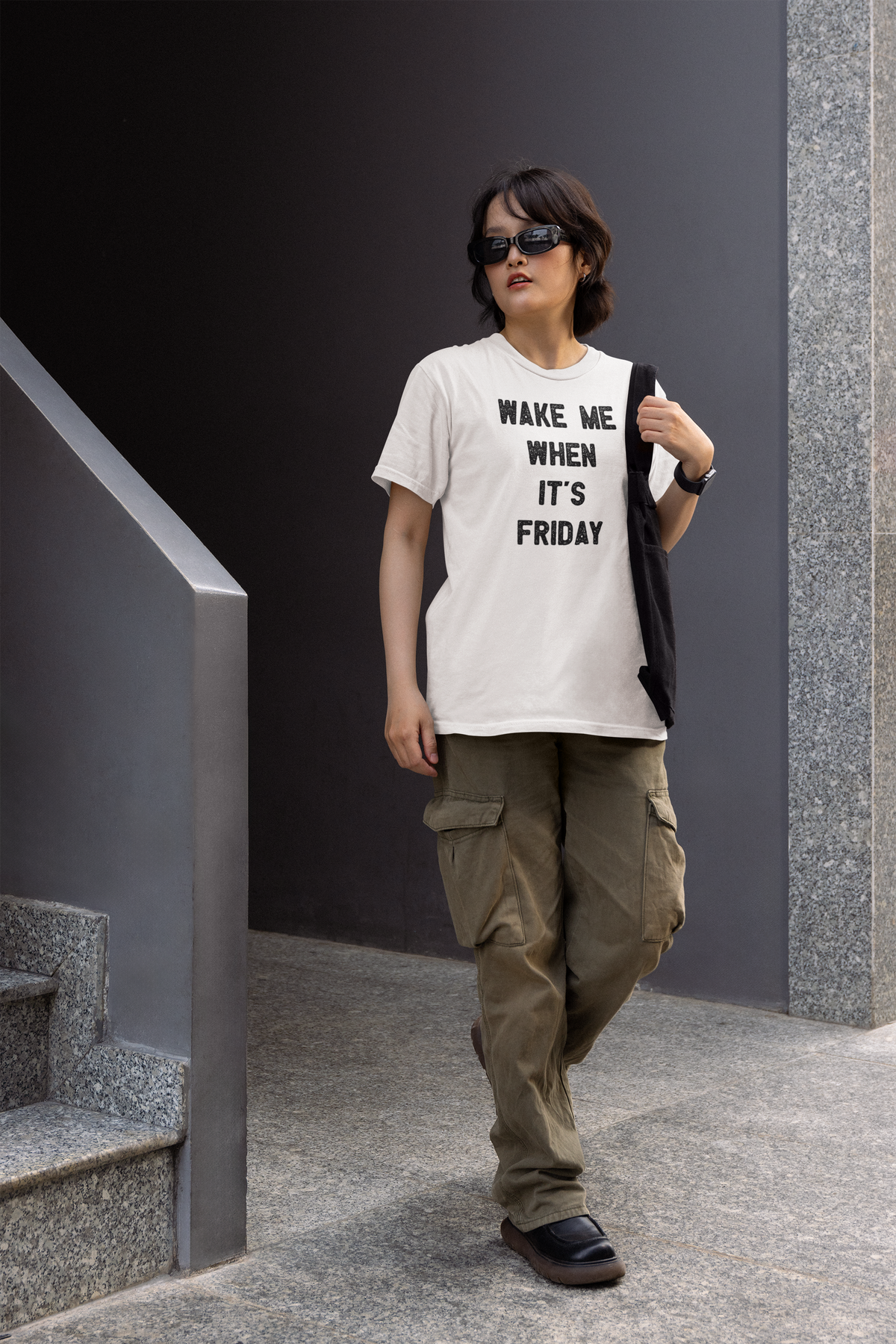'Wake Me When It's Friday' women's t-shirt in white, woman walking outdoors, work gift