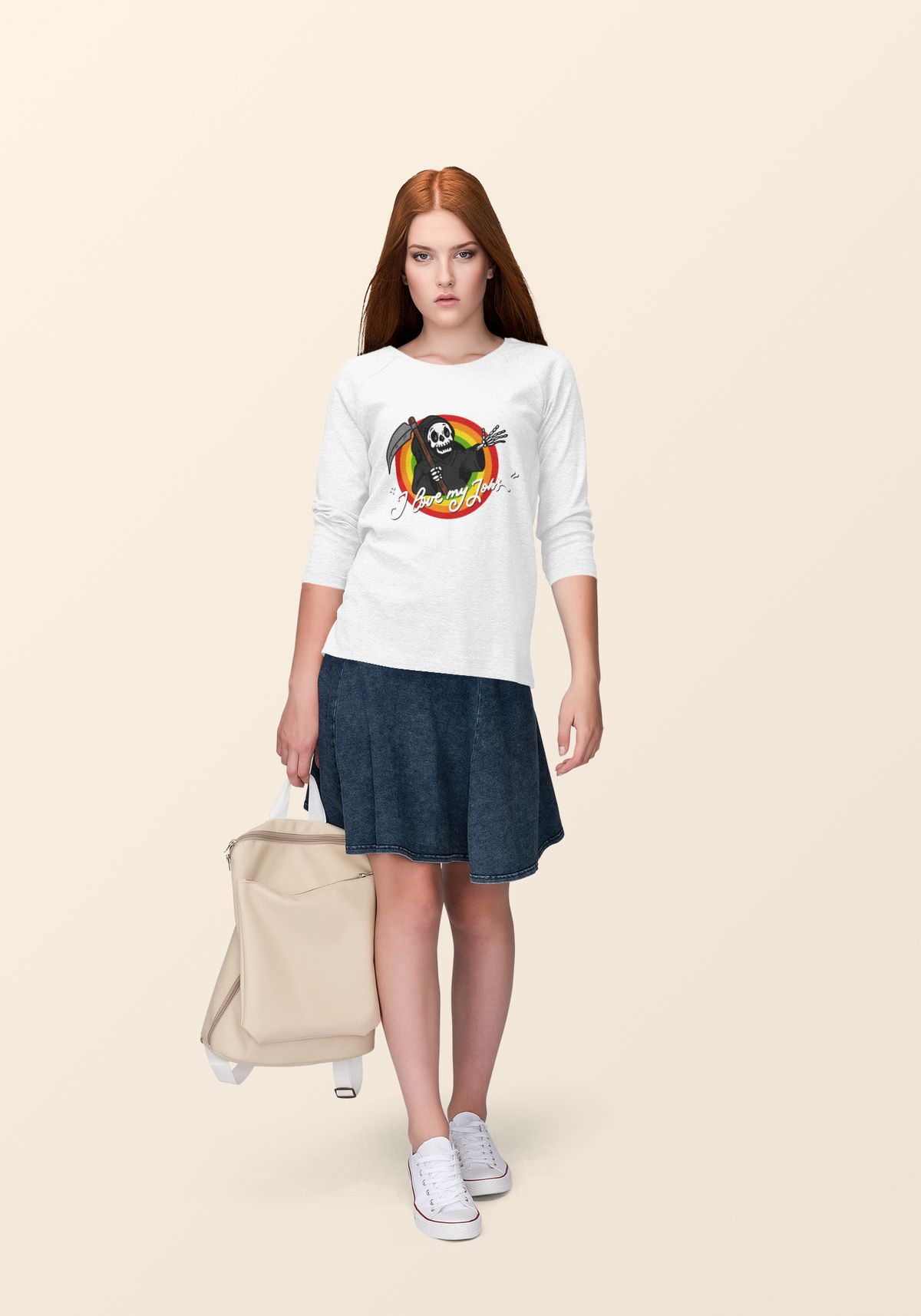 "I Love My Job" grim reaper tee in white, redhead woman wearing it with a suitcase, dark humor style