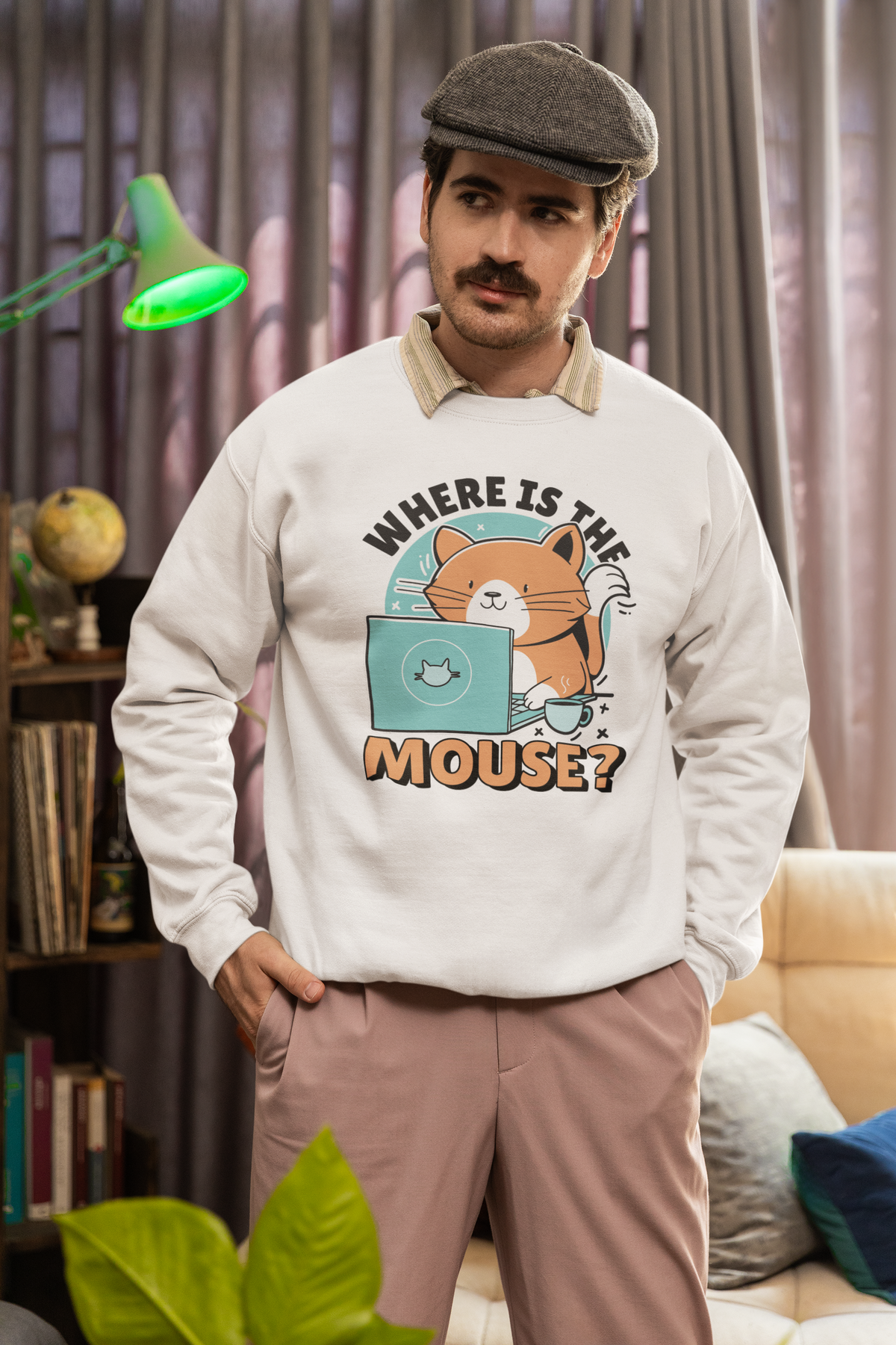 "Where Is The Mouse?" cat graphic sweatshirt in white, man in a flat cap wearing it indoors, funny gift for him