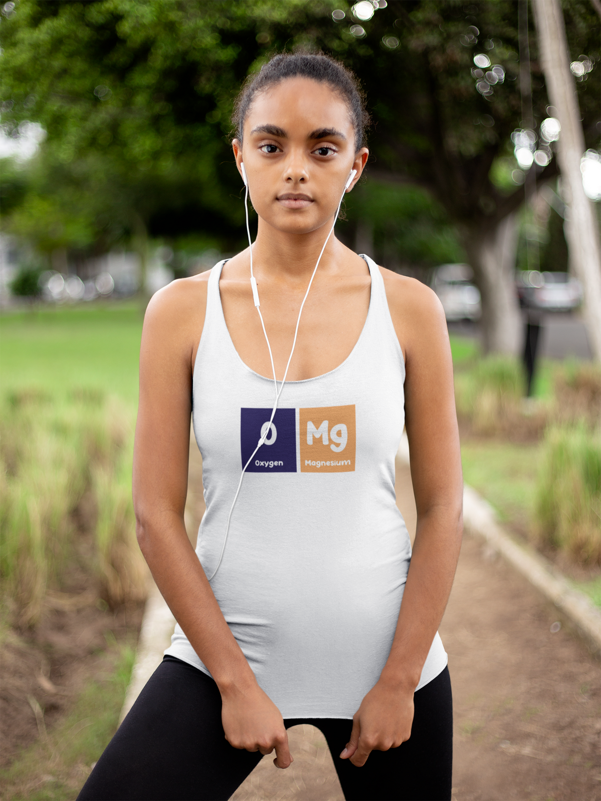 'O-Mg Periodic Table Women's Tank' in white, woman in a park, Tank Top mockup, Geekpsters