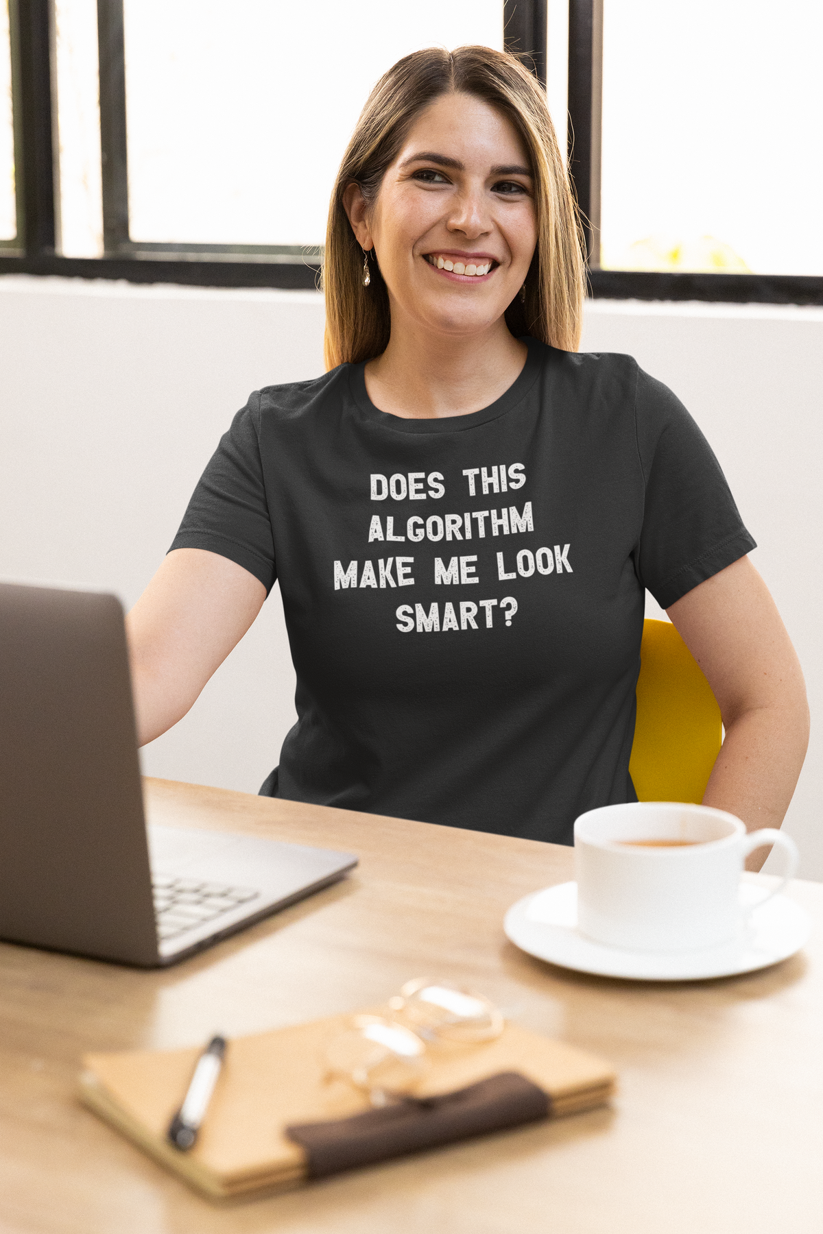 'Does This Algorithm Make Me Look Smart?' t-shirt in black, woman wearing it at desk with coffee, funny gift for developers