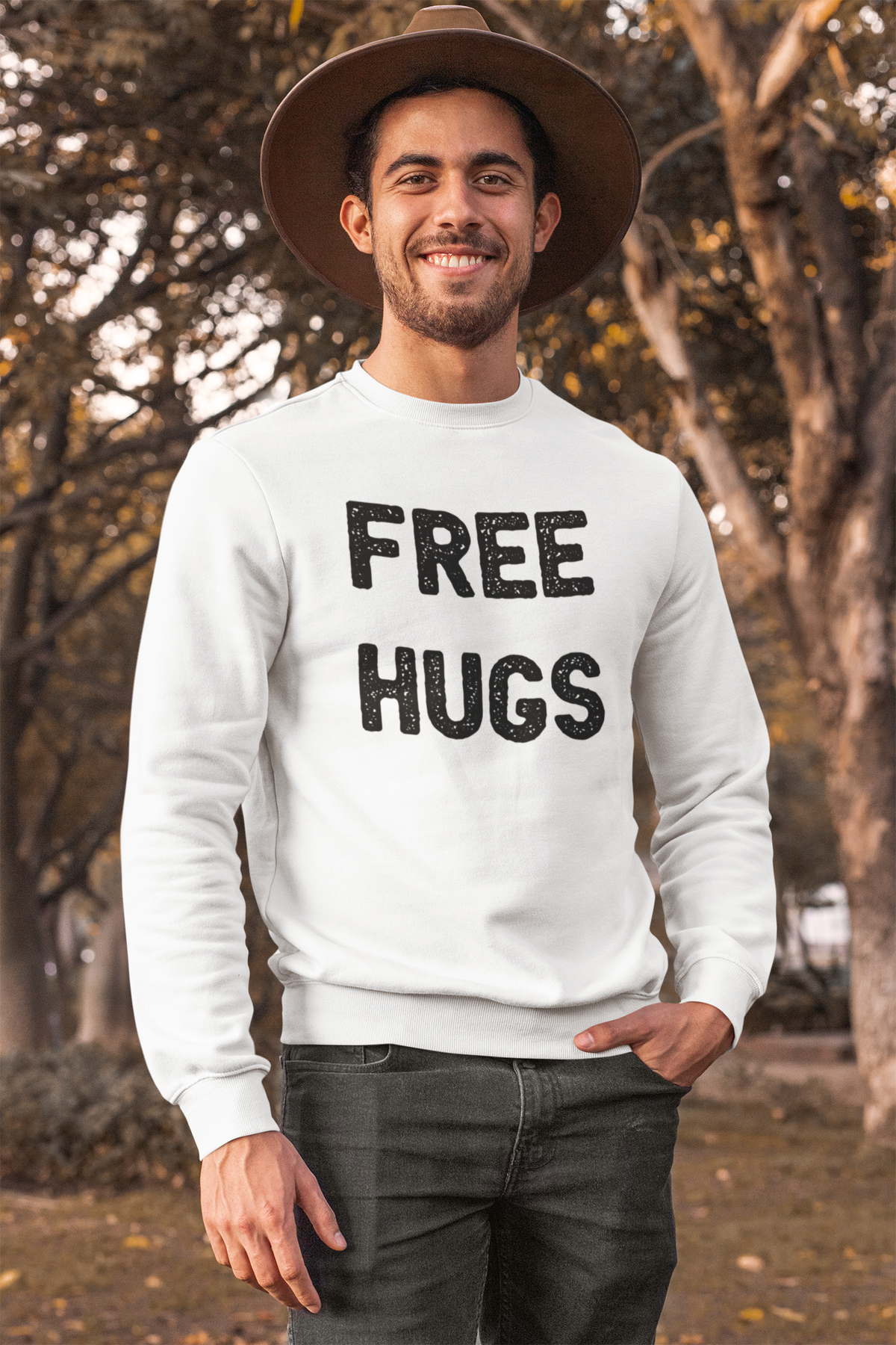 'Free Hugs' sweatshirt in sport grey, man wearing it in a park, funny sarcastic gift for him