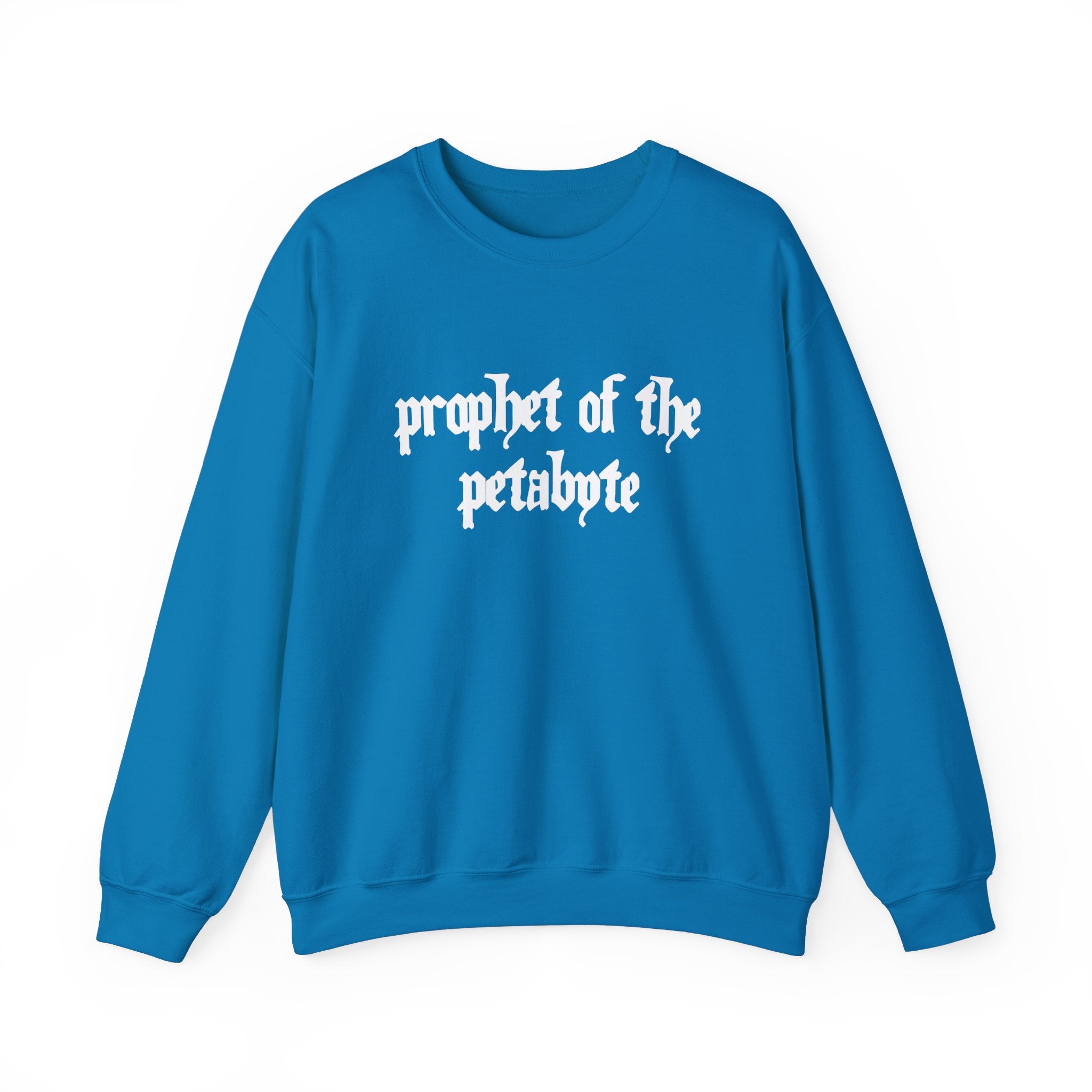 Wrap yourself in comfort and flair with our tech-savvy Prophet of the Petabyte - Sweatshirt. This blue garment showcases the phrase "prophet of the petabyte" in a striking, white, gothic-style font on the front.