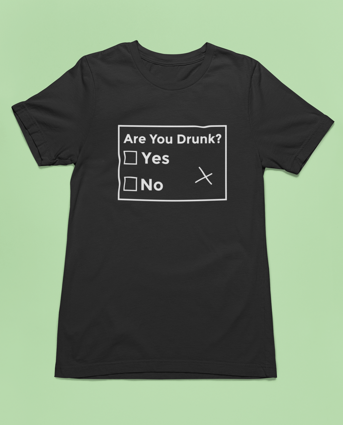 Are You Drunk checklist t-shirt in black, flat lay on a green background, funny sarcastic party gift