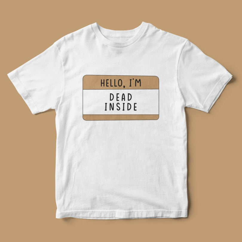 Hello, I'm Dead Inside T-Shirt with a quirky design featuring a name tag graphic against a beige background.