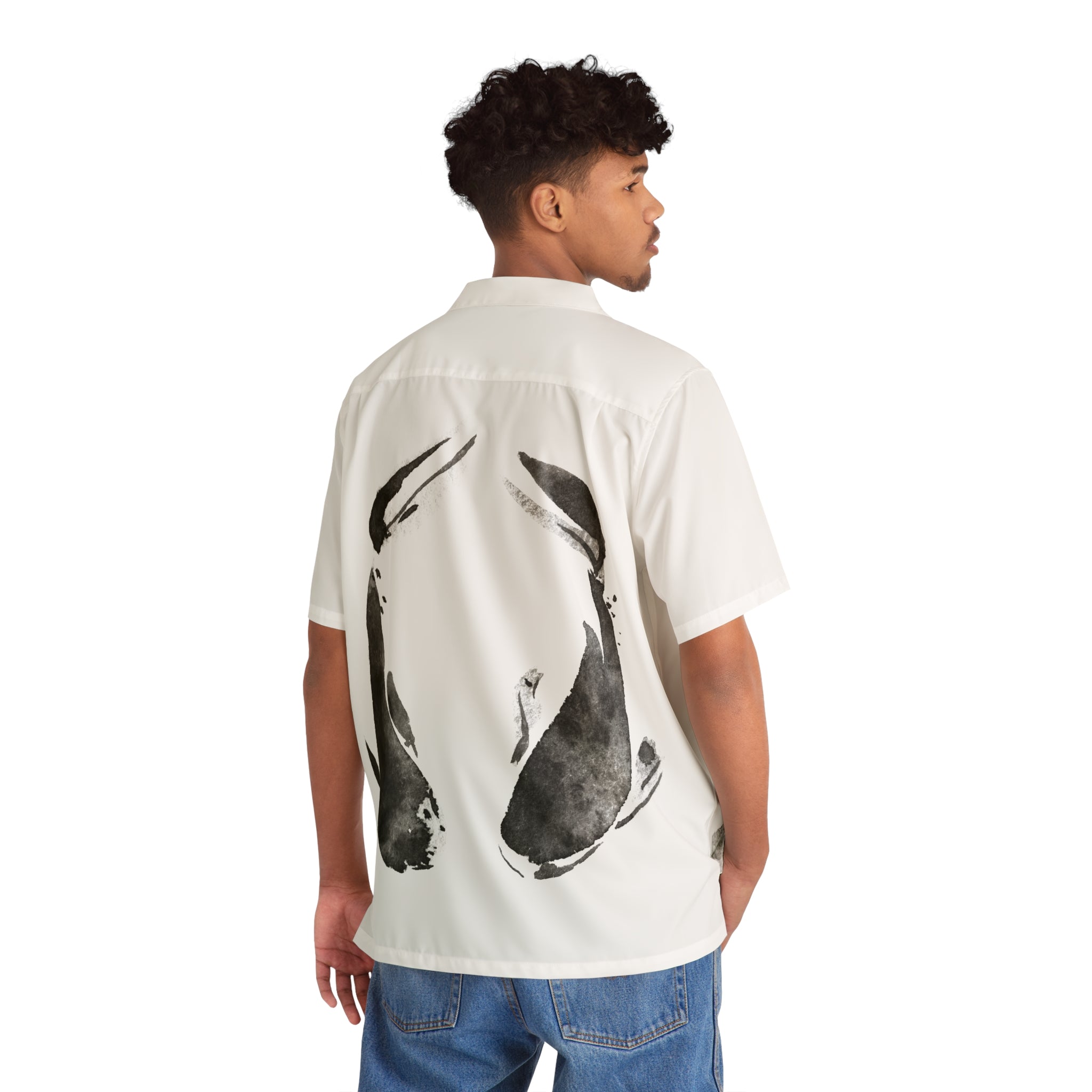 A person wearing the Oron's Collection LTE - Spirit Animals T-Shirt, featuring a black koi fish design on the back of a white short-sleeve shirt, pairs it stylishly with blue jeans against a white background.