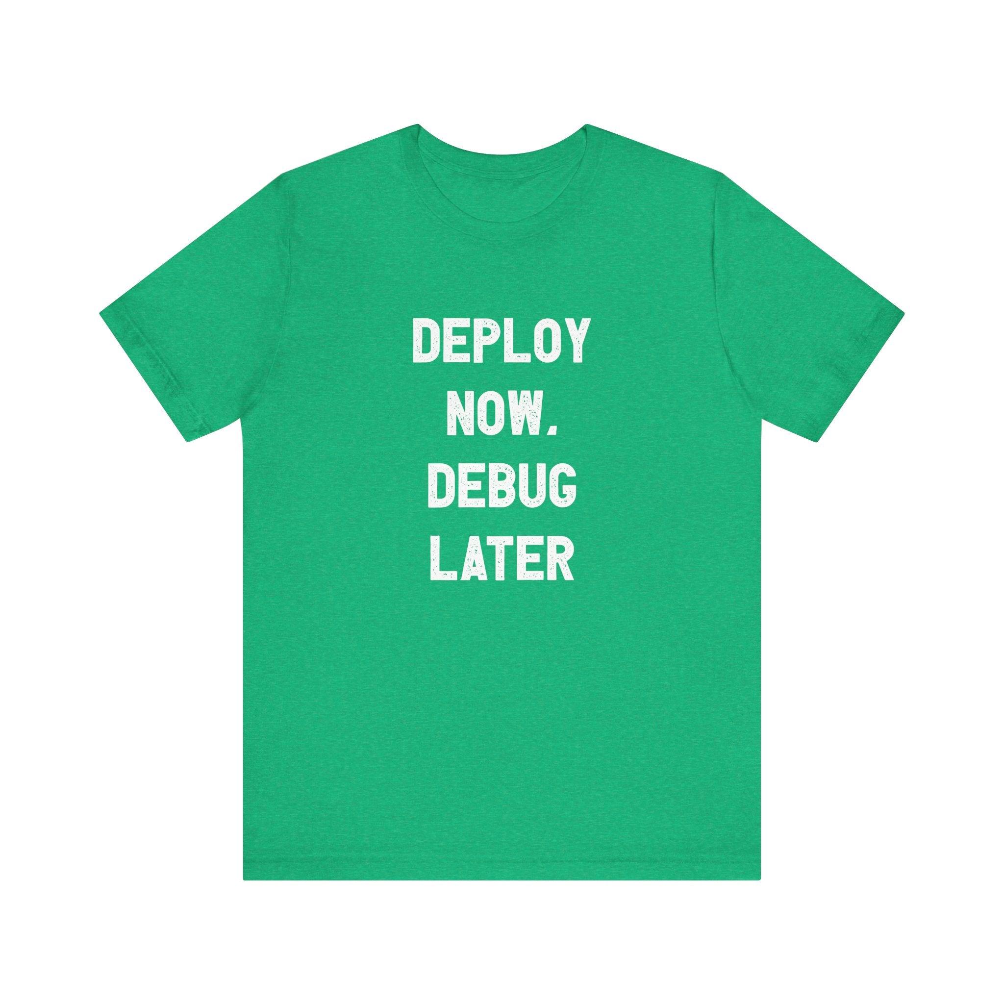 This green Airlume cotton T-shirt, named the Deploy Now, Debug Later - T-Shirt, showcases the striking message "DEPLOY NOW. DEBUG LATER" in bright white capital letters on the front, making it an ideal choice for tech enthusiasts and developers.