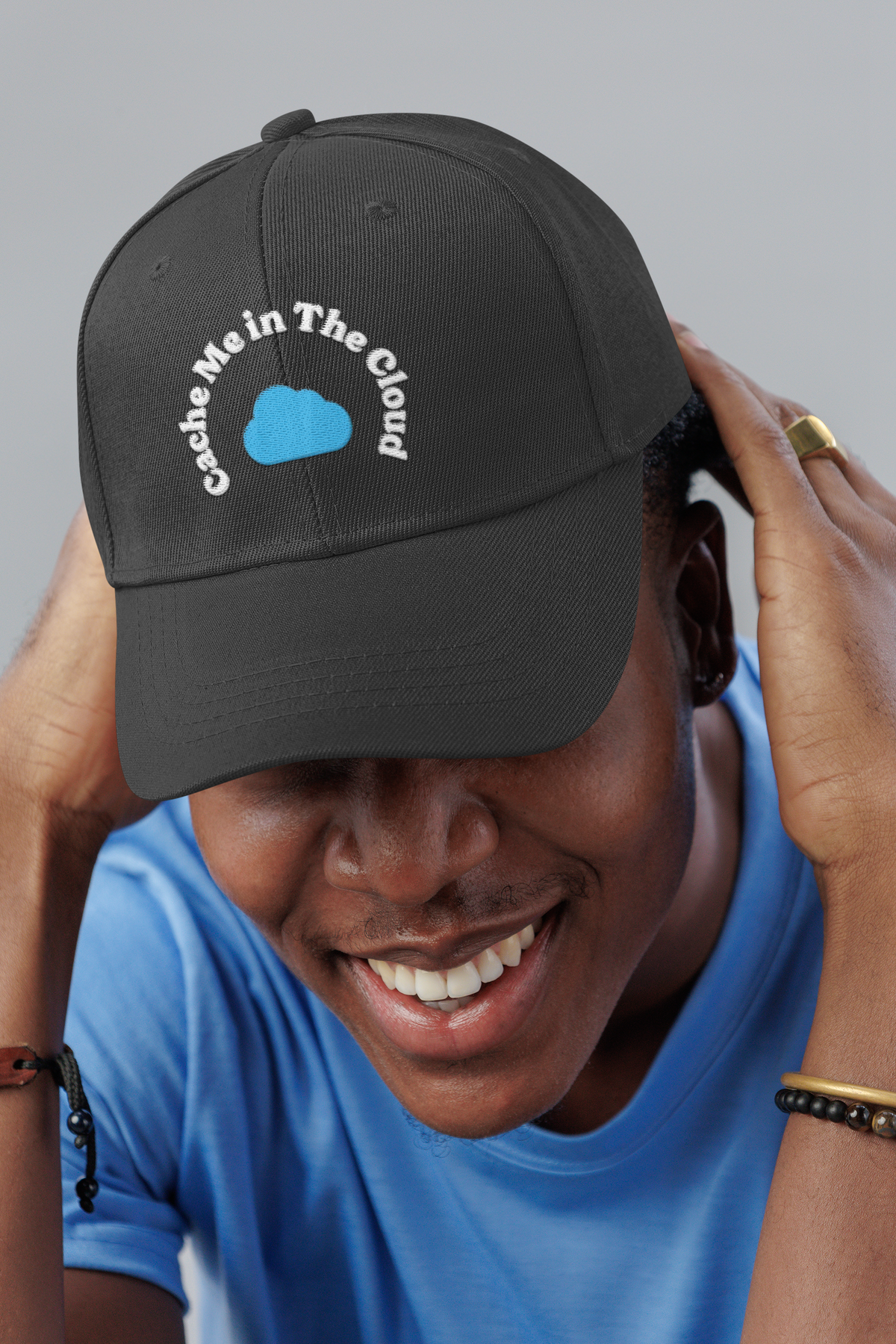 Cache Me in The Cloud DevOps dad hat, smiling man in a studio, lifestyle mockup, Geekpsters