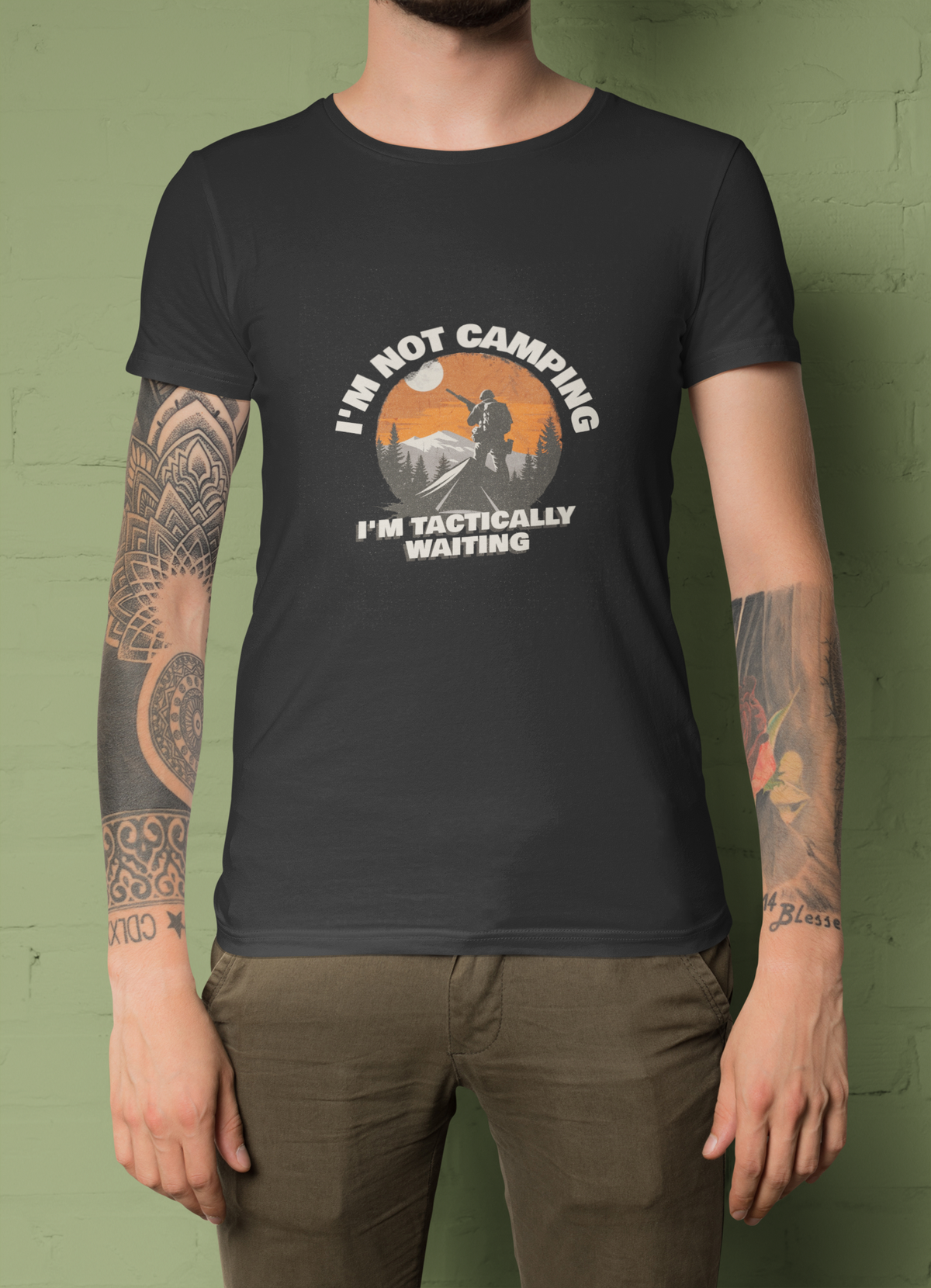 'I'm Not Camping' hiker graphic t-shirt in charcoal, tattooed man wearing it, funny camping gift