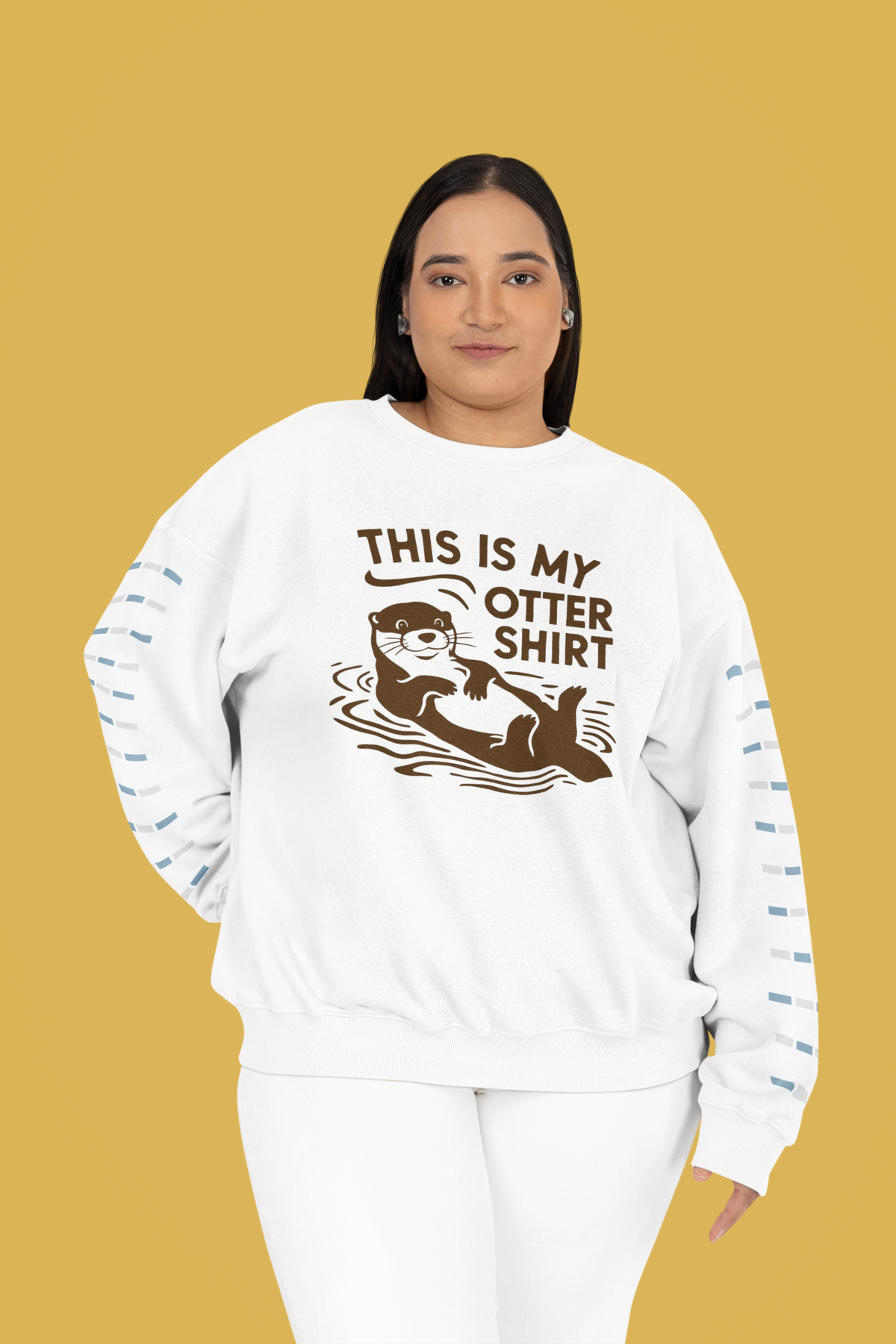 'This Is My Otter Shirt' sweatshirt in white, woman wearing it on a mustard background, funny pun gift