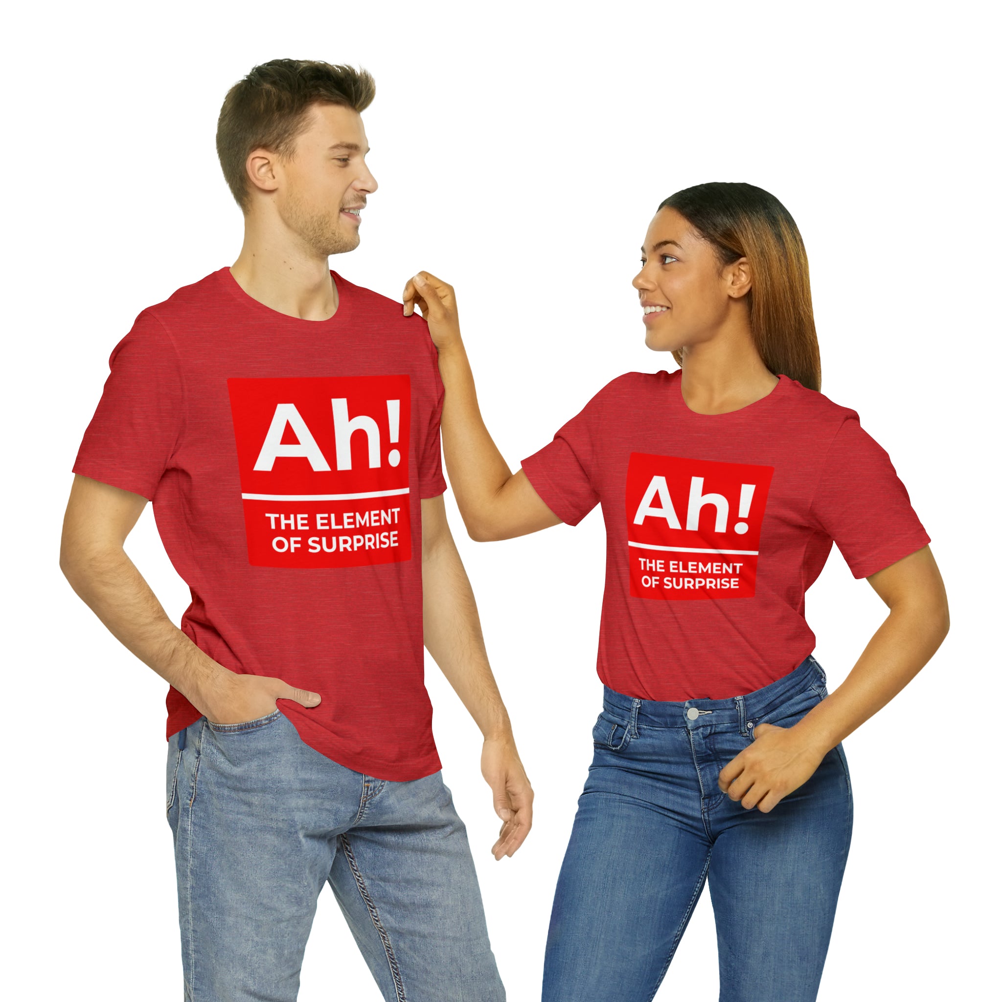 A man and woman wearing a Ah! the Element of Surprise T-shirt emblazoned with the word "ah".