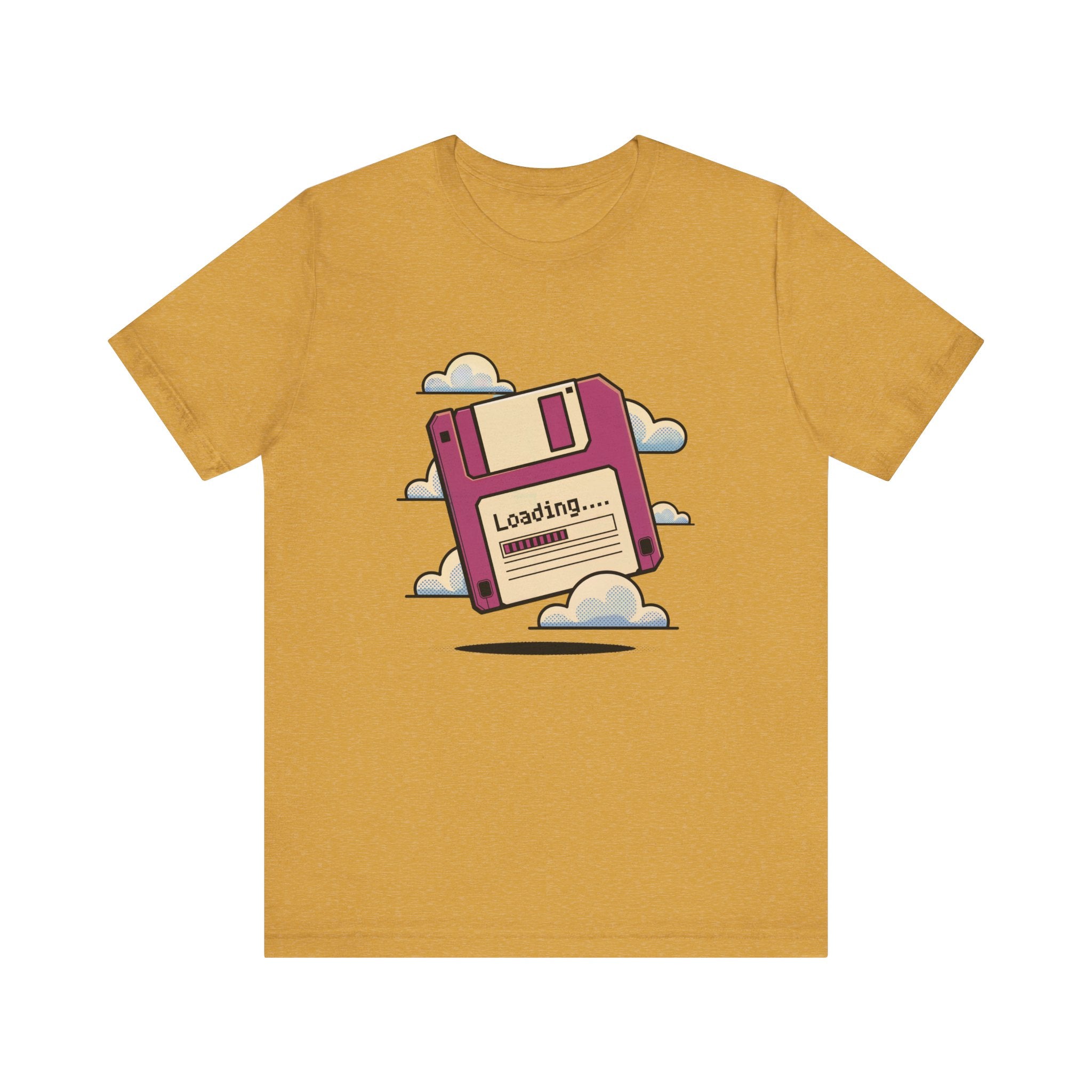 The Floppy disk -T Shirt in mustard yellow features a pink floppy disk graphic with "Loading..." above clouds, made from soft cotton with tapered shoulders for a stylish fit.