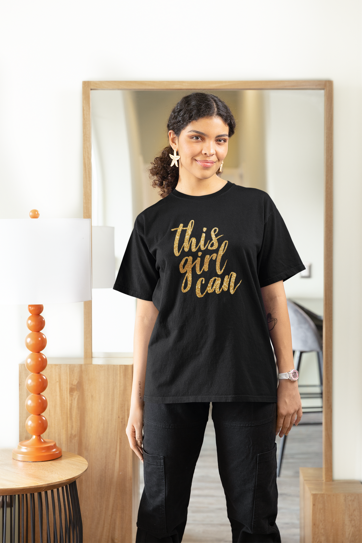 This Girl Can T-shirt in black, woman wearing it indoors, motivational gift for women