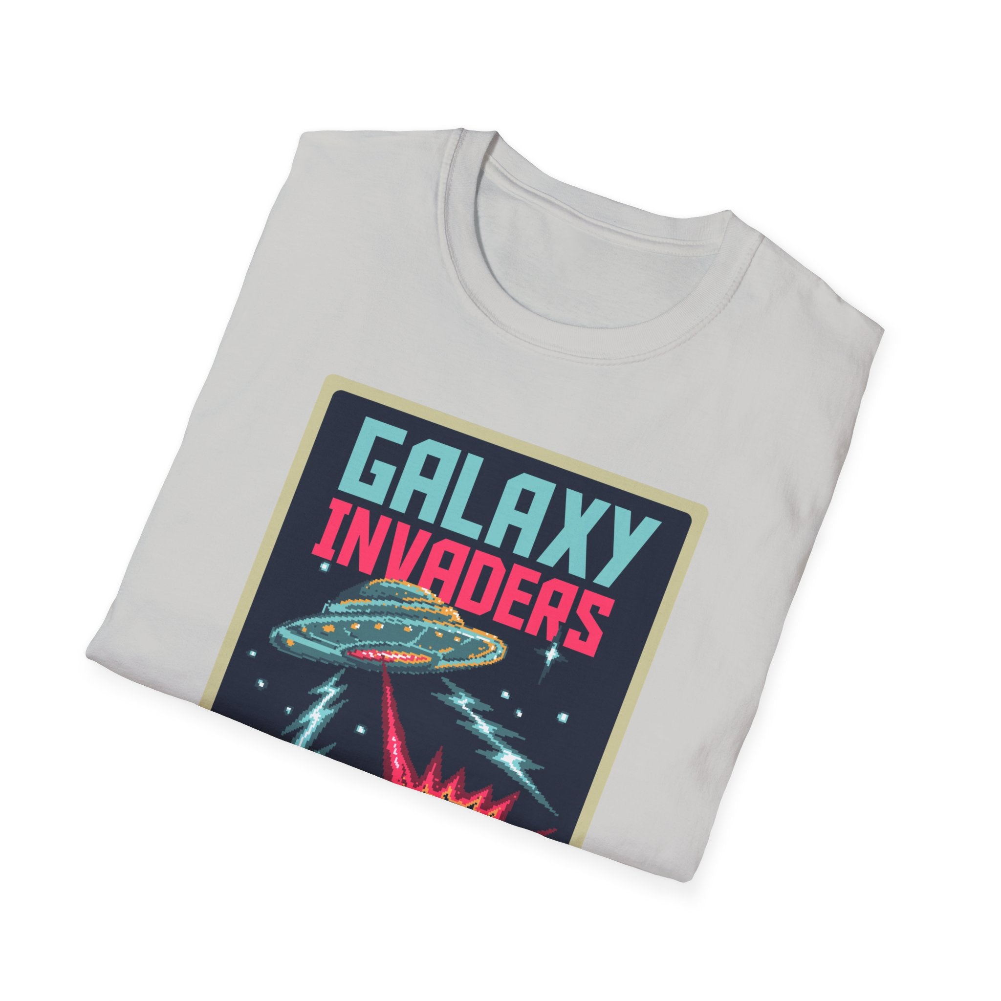 A folded Pixel Galaxy Invaders T-Shirt adorned with a retro print featuring a UFO and laser beams on a gray background. Ideal for any intergalactic explorer.