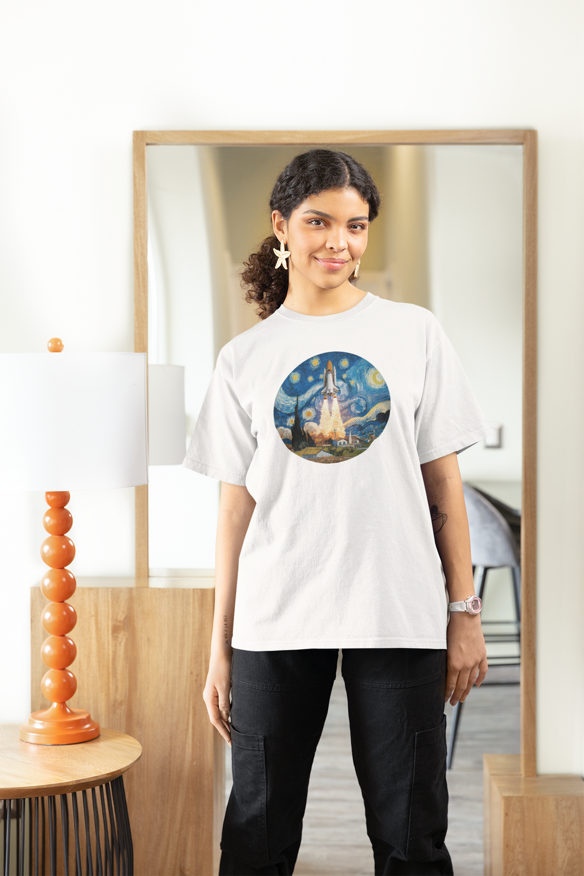 Van Gogh Spaceship Women's Tee in white, woman wearing it at home, starry night rocket print for space lovers