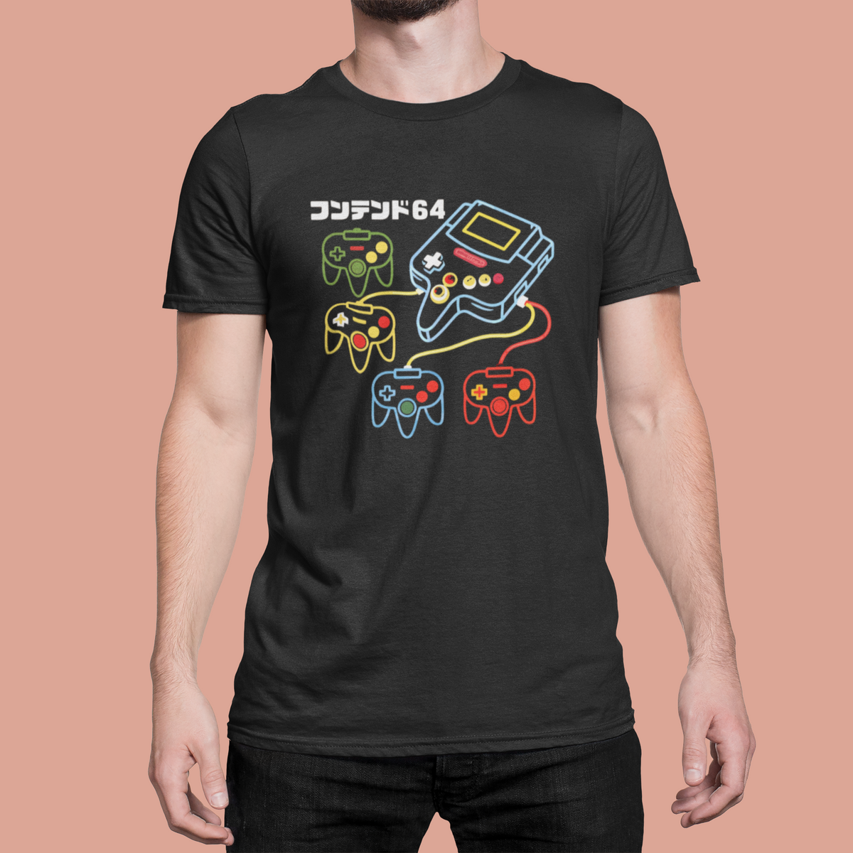 Retro game console t-shirt in black, man wearing it against pink background, funny gamer tee
