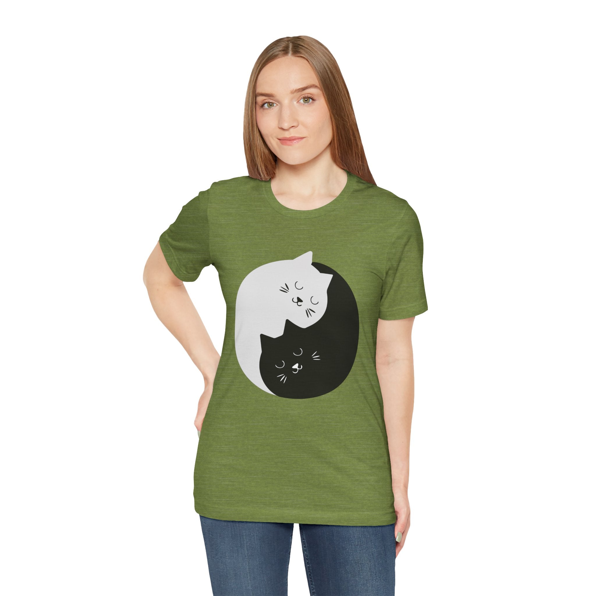 A woman in a YING-ANG KITTIES T-Shirt featuring a graphic of a white and a black cat nestled together in a Ying & Yang Kitties design.
