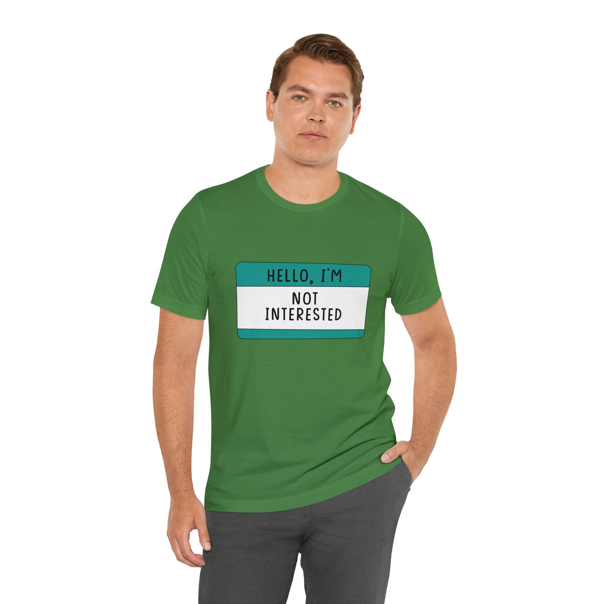 A man wearing a green Hello, I'm Not Interested T-Shirt.