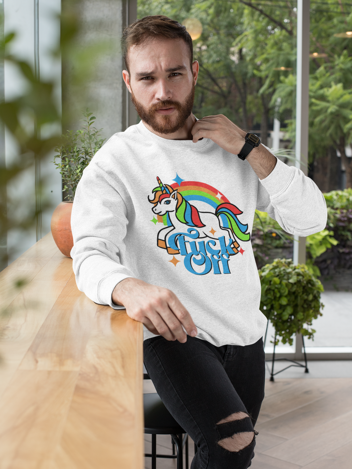 F Off Sweatshirt in white, man wearing it indoors, funny unicorn rainbow crewneck gift for him