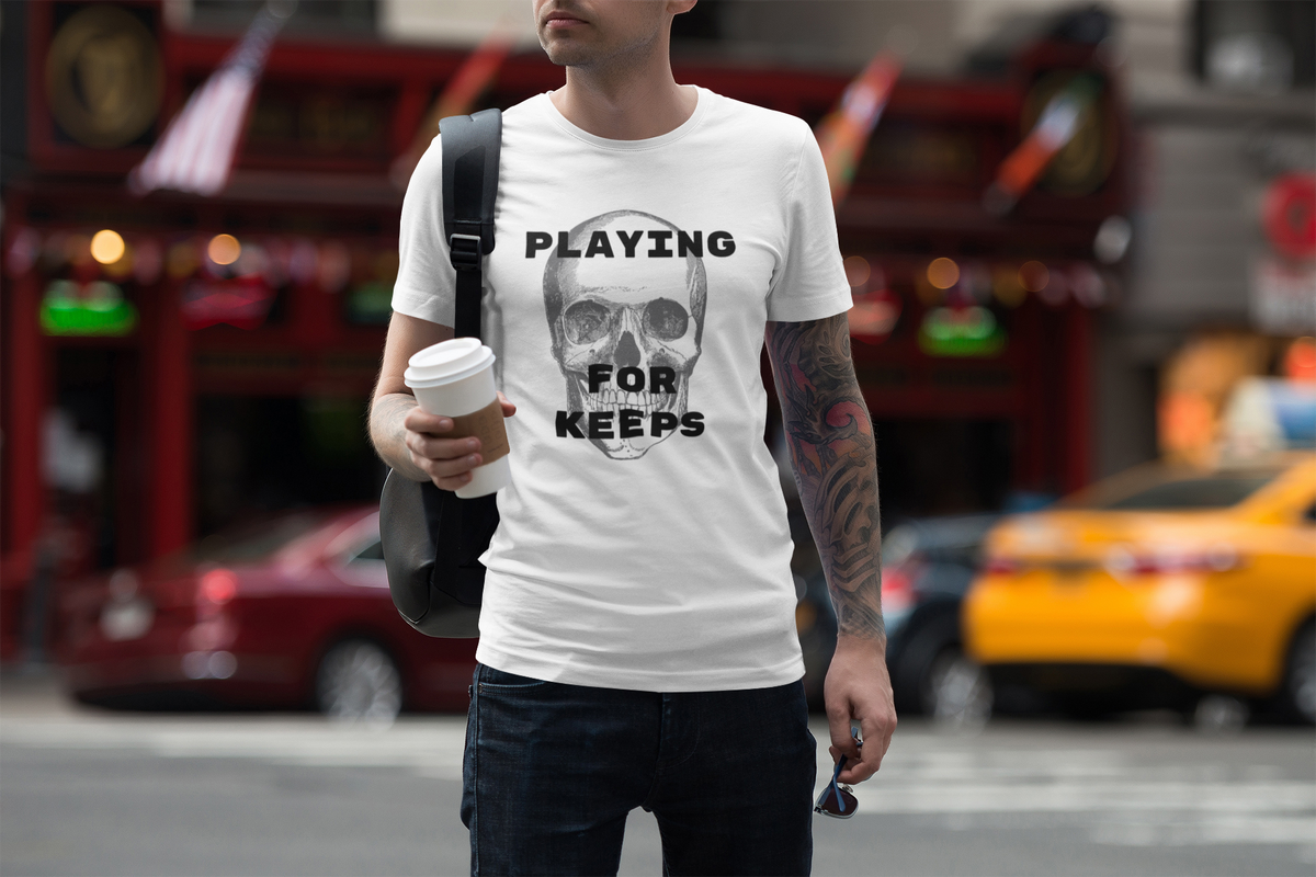 'Playing For Keeps' skull t-shirt in white, man wearing it on a city street, edgy gothic gift shirt