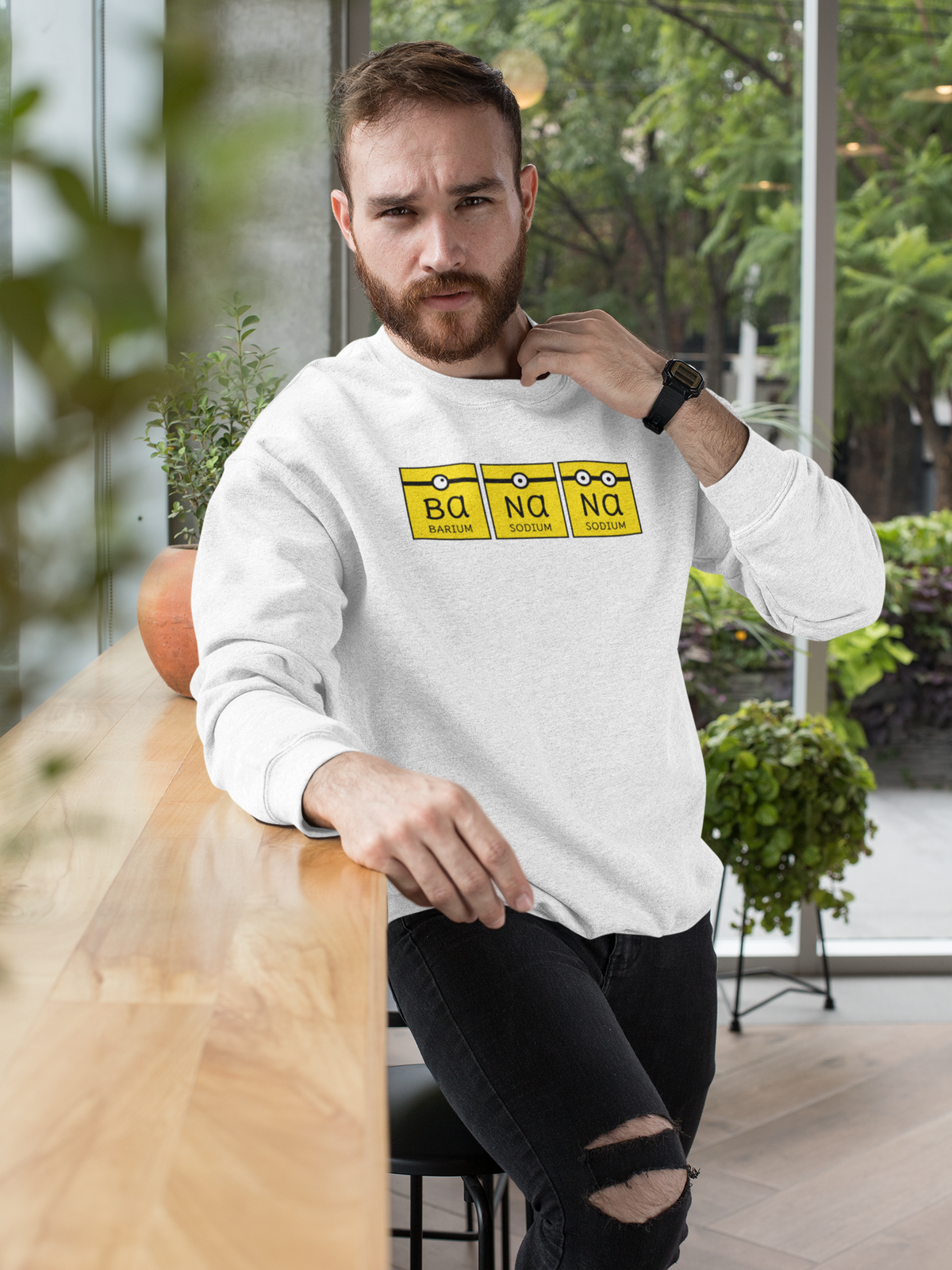 Ba-Na-Na periodic table banana element pun crewneck sweatshirt, model wearing it indoors
