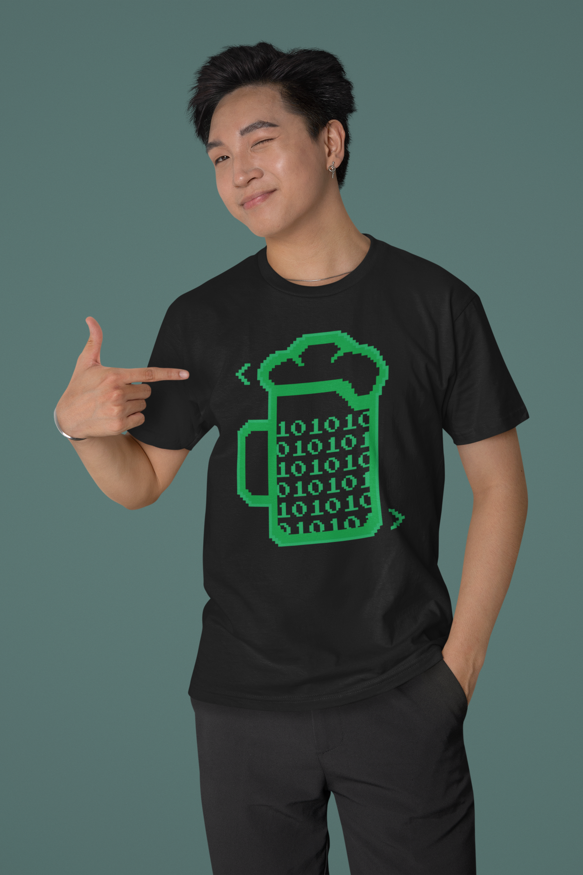 'This Is How I Love to Code' beer mug t-shirt in black, man model wearing it against a dark green wall, gift for coders