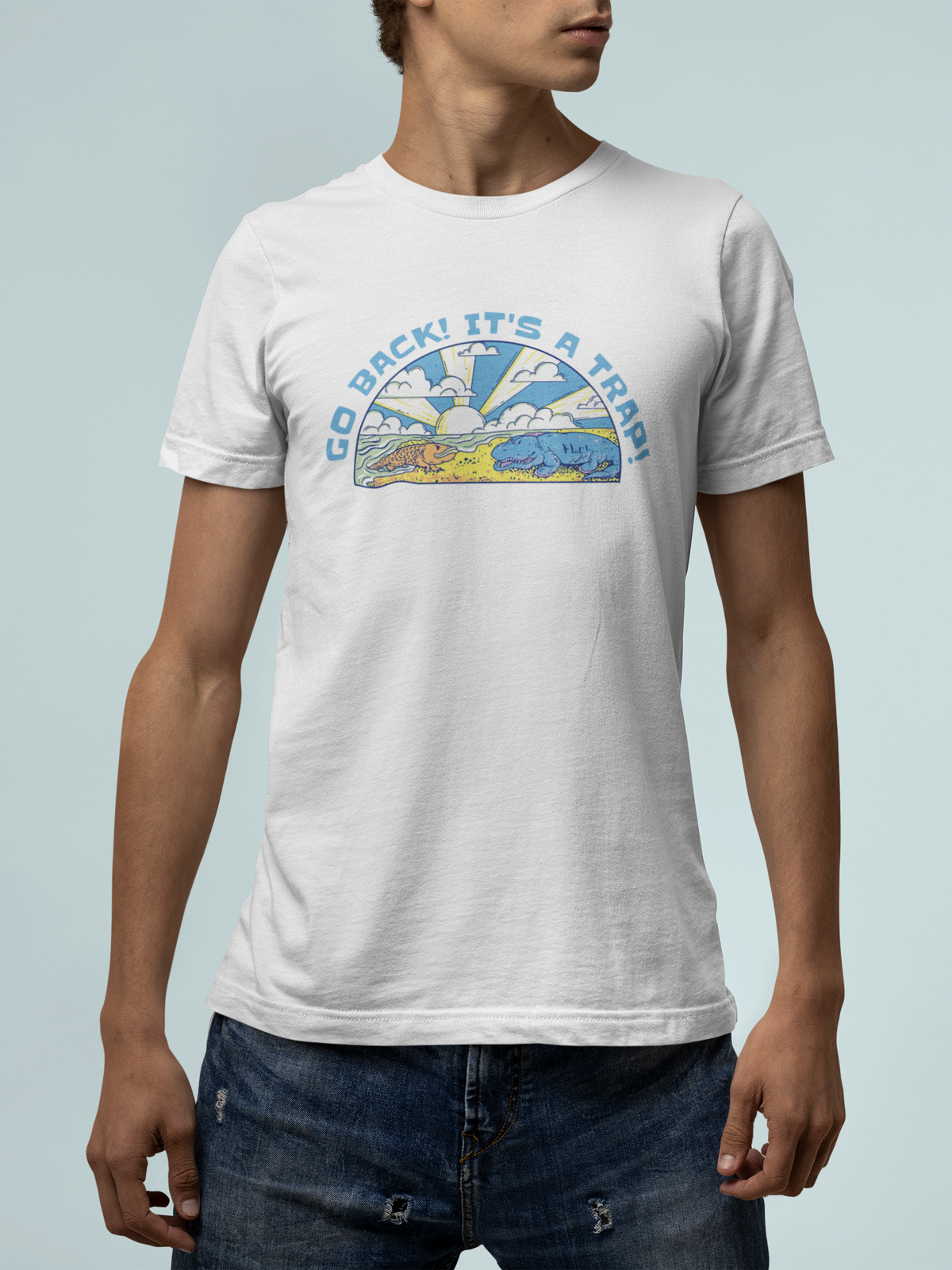 'Go Back It's A Trap' t-shirt in white, man wearing it on teal background, funny quirky gift shirt
