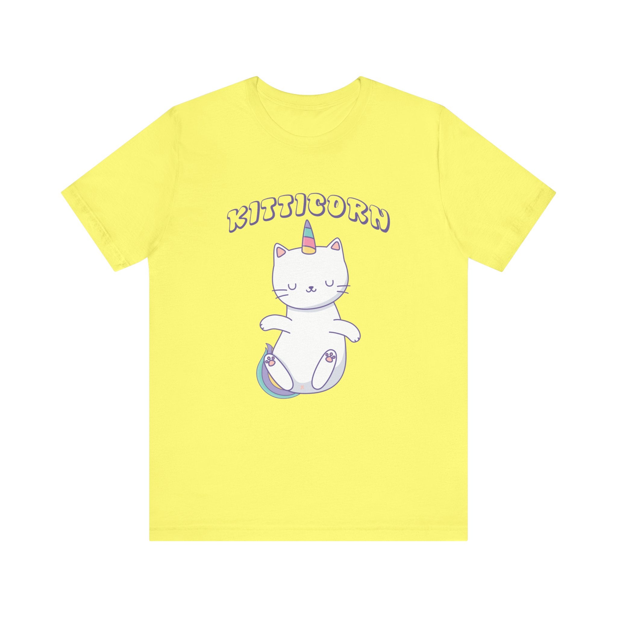 A yellow unisex Kitticorn tee featuring a graphic of a cartoon cat with a unicorn horn sitting on a cloud, with the word "kitticorn" printed above.