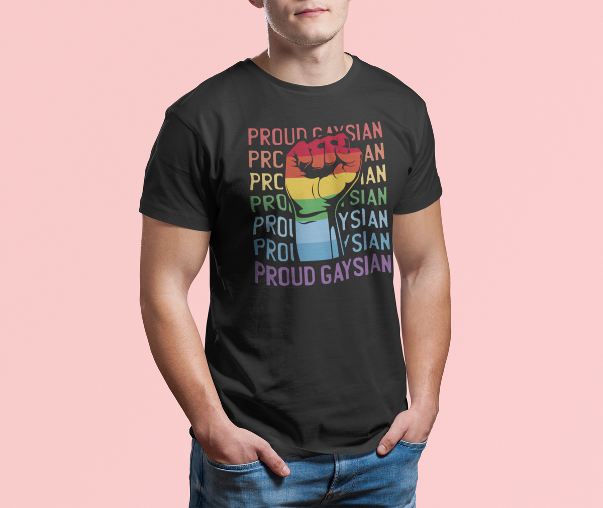 'Proud Gaysian' fist T-shirt in black, man wearing it against a pink backdrop, pride gift shirt