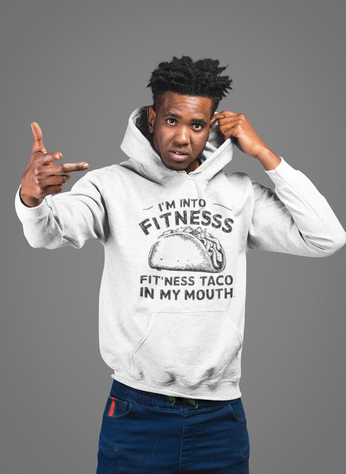 'I'm Into Fitness' hoodie in white, man wearing it in a studio, Hoodie mockup, Geekpsters