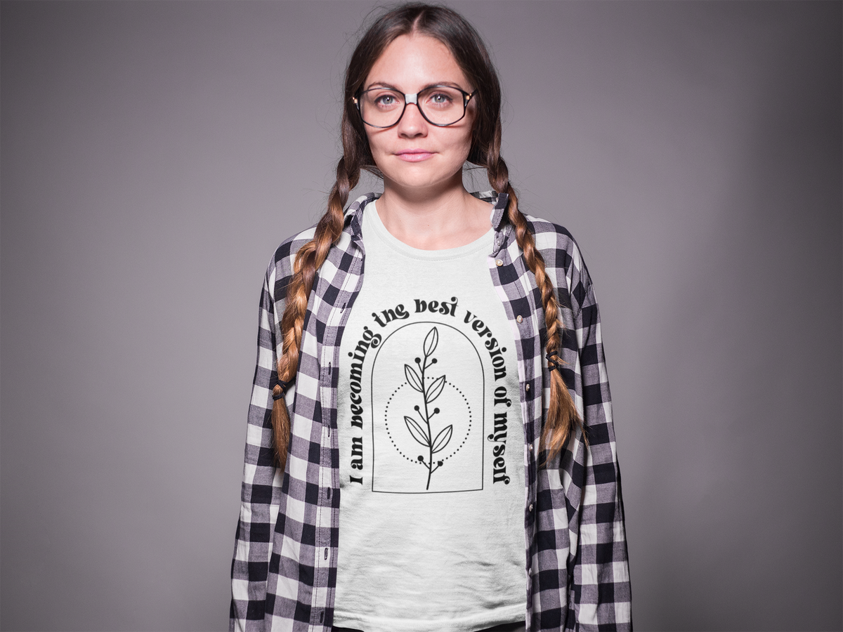 'I Am Becoming The Best Version Of Myself' t-shirt in white, woman wearing it