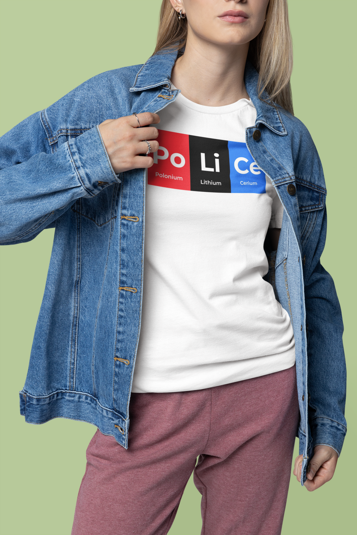 'Po-Li-Ce' periodic table t-shirt in white, woman in a denim jacket wearing it, funny science pun tee
