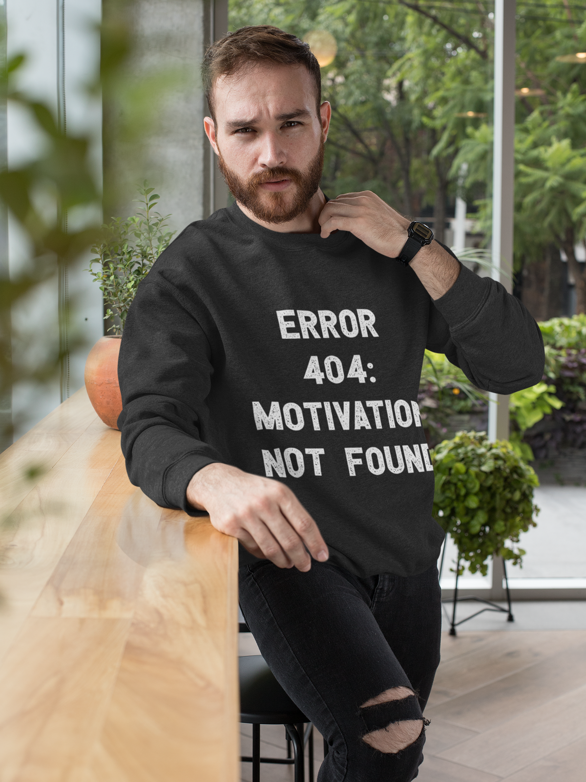 'Error 404 Motivation Not Found' sweatshirt in black, bearded man indoors, funny programmer gift for him