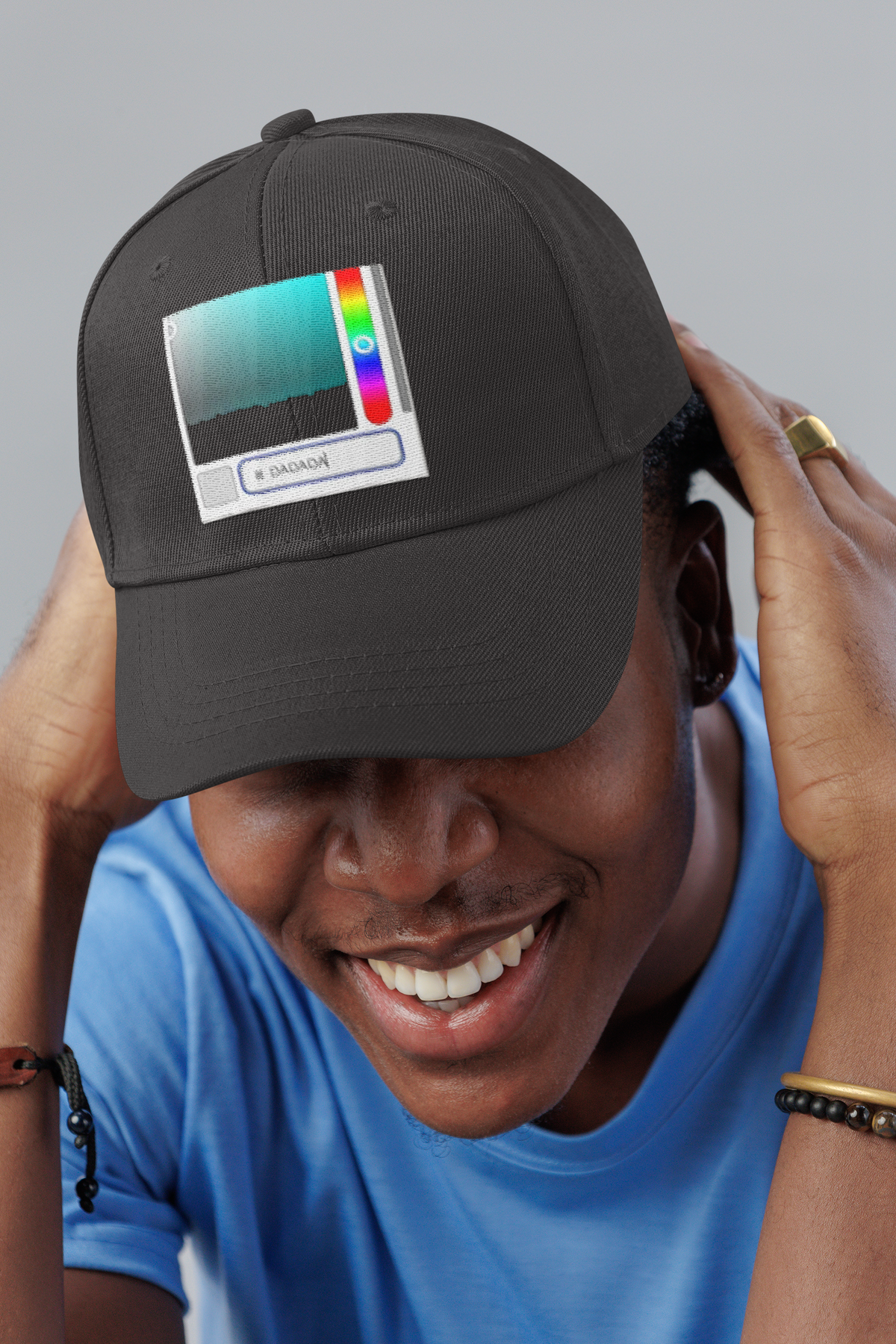 DADA Paint abstract art dad hat, smiling man in a studio, lifestyle mockup, Geekpsters