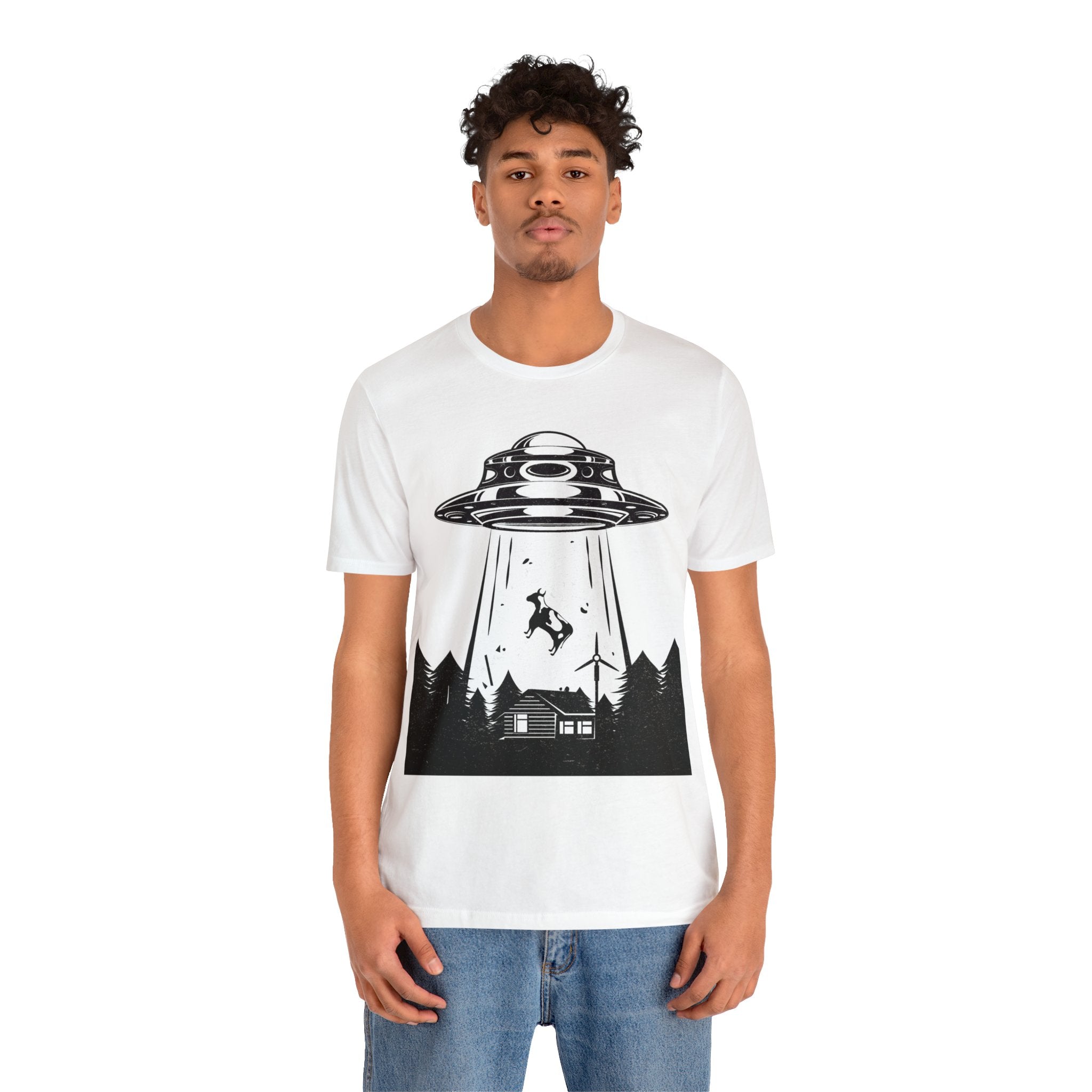 A man wearing a white t-shirt featuring an Alien Abduction image is the perfect geeky accessory for sci-fi enthusiasts.