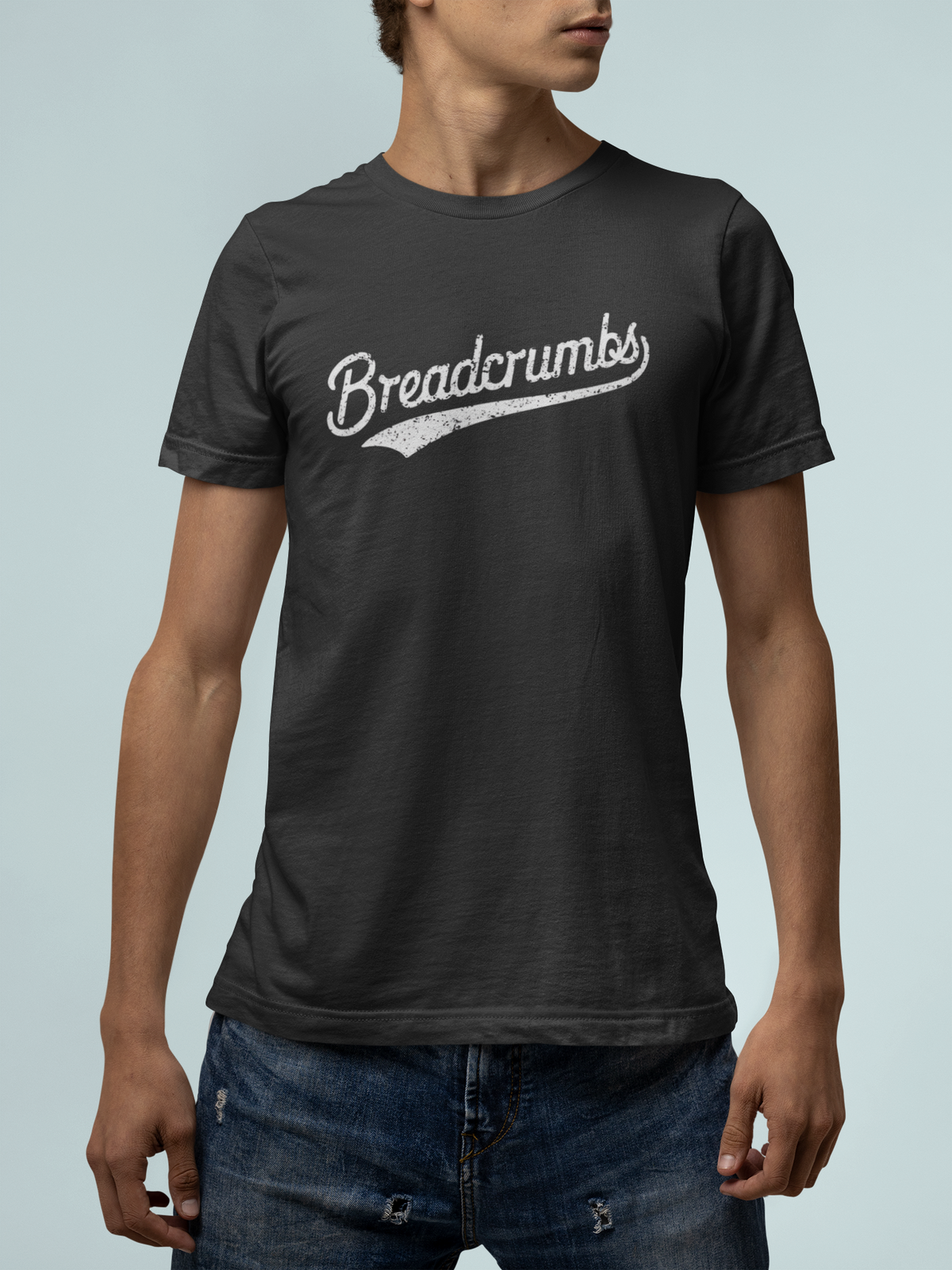 'Breadcrumbs' script logo t-shirt in black, man wearing it, funny gift for developers
