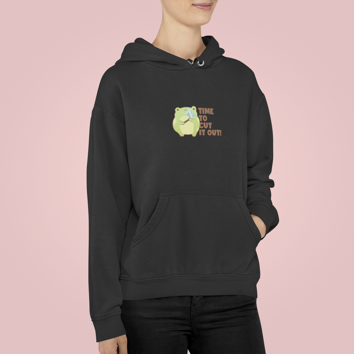 'Time to Cut It Out' frog hoodie in white, woman wearing it in studio, funny science pun gift