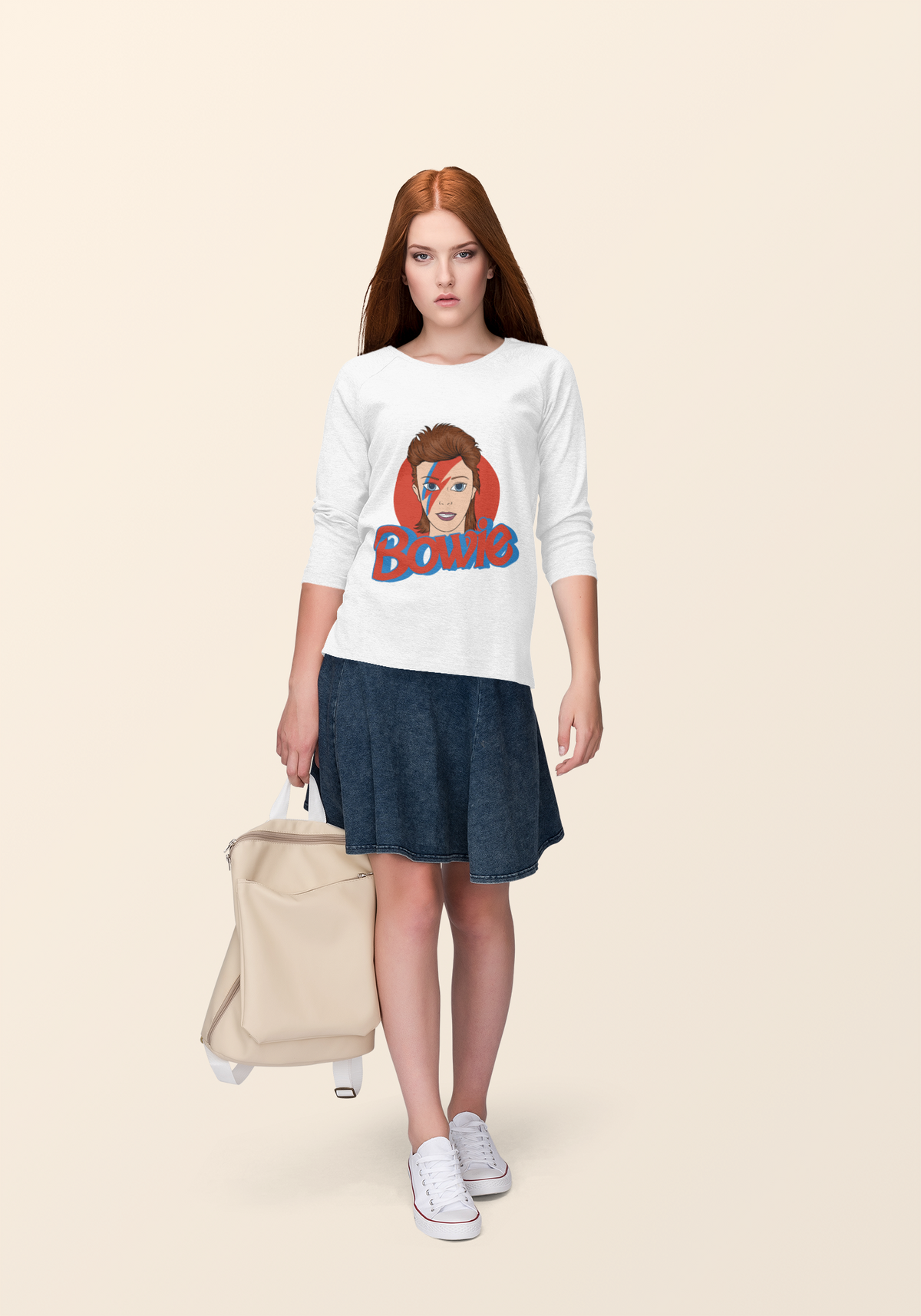 Bowie lightning bolt sweatshirt in white, redhead woman wearing it with a suitcase, music fan style