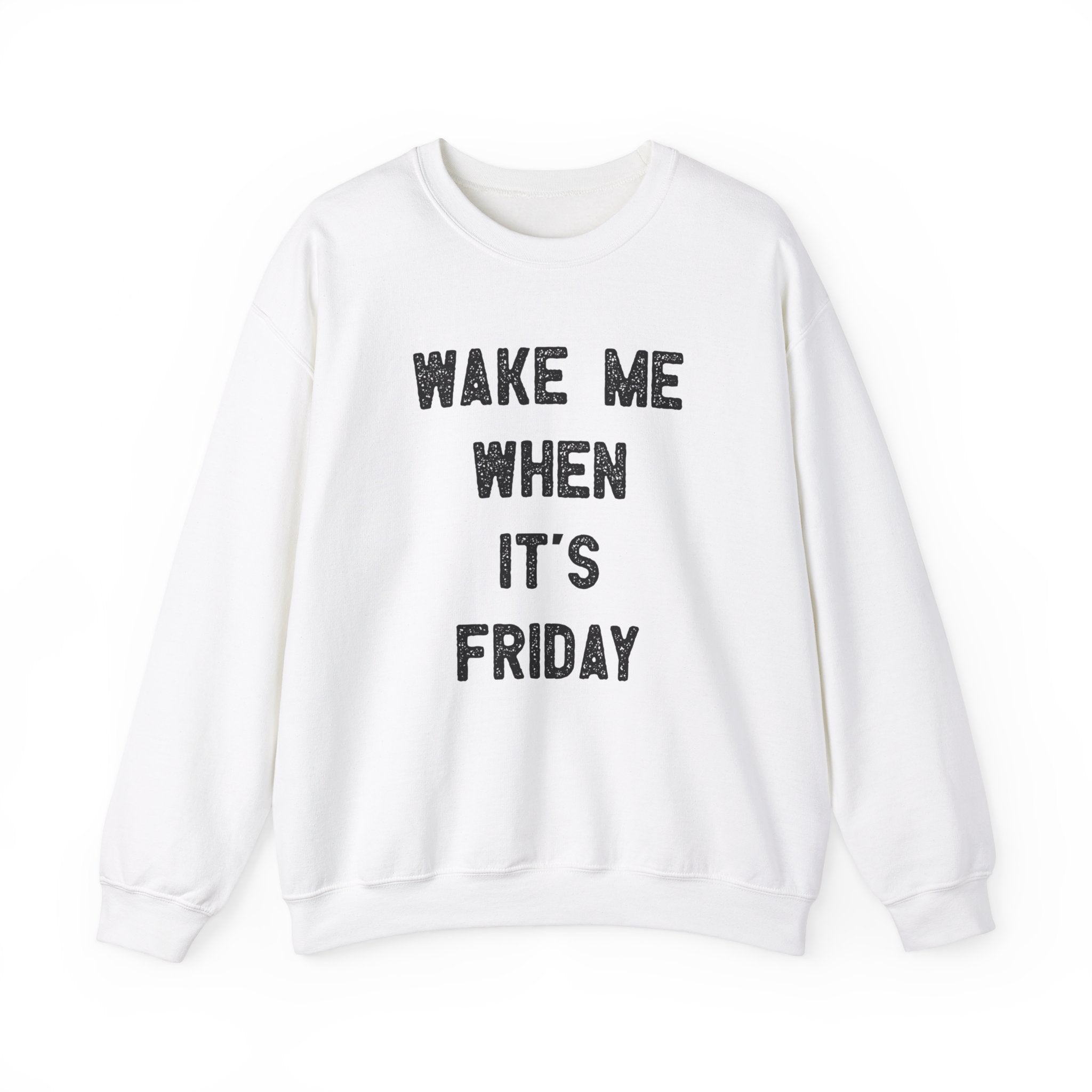 A stylish Wake Me When It's Friday - Sweatshirt with the text "WAKE ME WHEN IT'S FRIDAY" printed in bold black capital letters on the front, perfect for a cozy day.