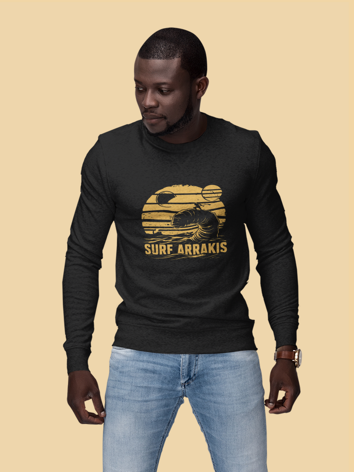 Surf Arrakis sandworm sweatshirt in black, man wearing it on a tan background, funny sci-fi gift idea