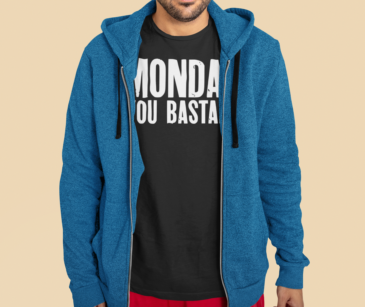 'Monday You Bastard' t-shirt in black, man wearing it under an open blue hoodie, sarcastic office gift