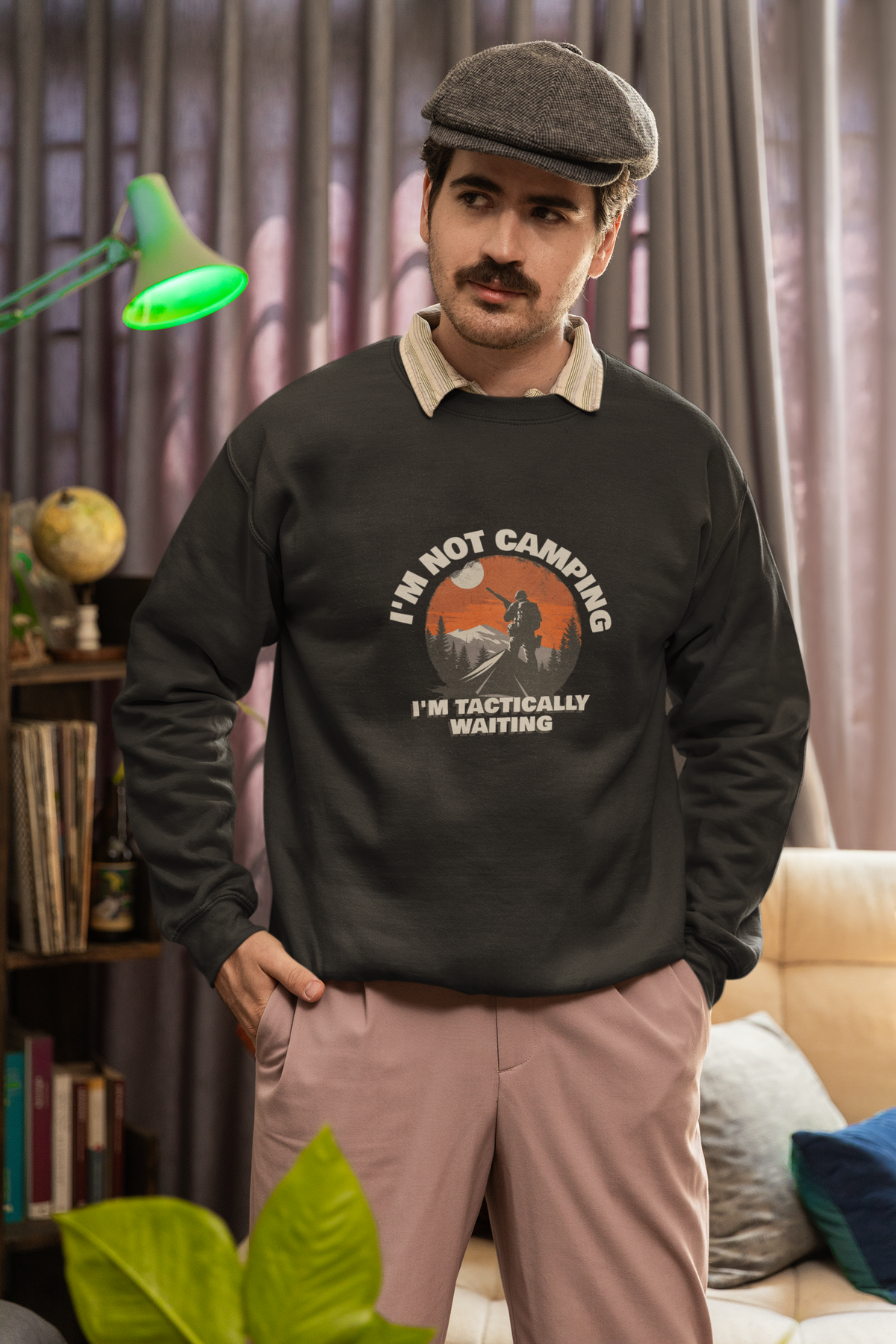 'I'm Not Camping' hiker graphic sweatshirt in black, man wearing it indoors, funny outdoor pun gift