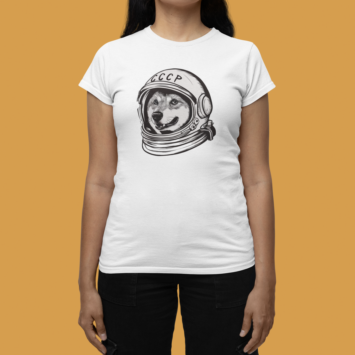 'CCCP Astronaut Dog' women's tee in white, woman wearing it against a yellow backdrop, funny quirky graphic gift