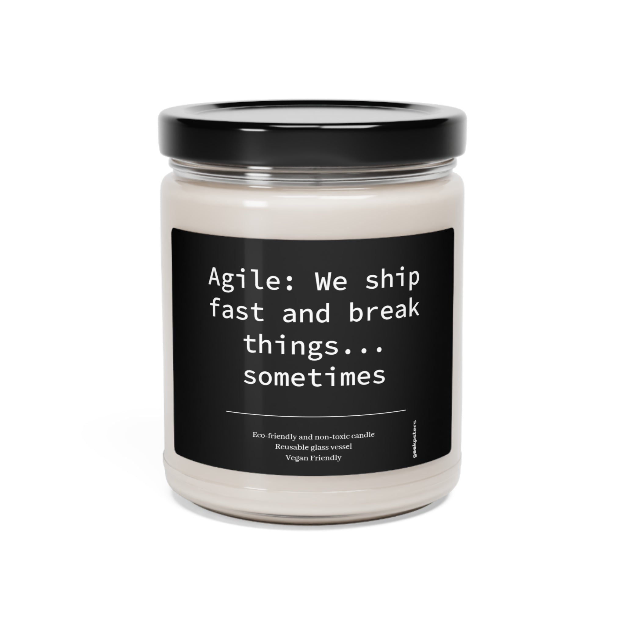 A Agile: We Ship Fast and Brake Things scented soy wax candle, highlighting eco-friendly and vegan-friendly attributes.
