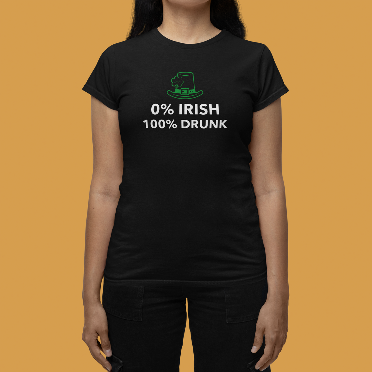 '0% Irish 100% Drunk' women's tee in black, woman wearing it on orange backdrop, funny St Patrick's Day gift