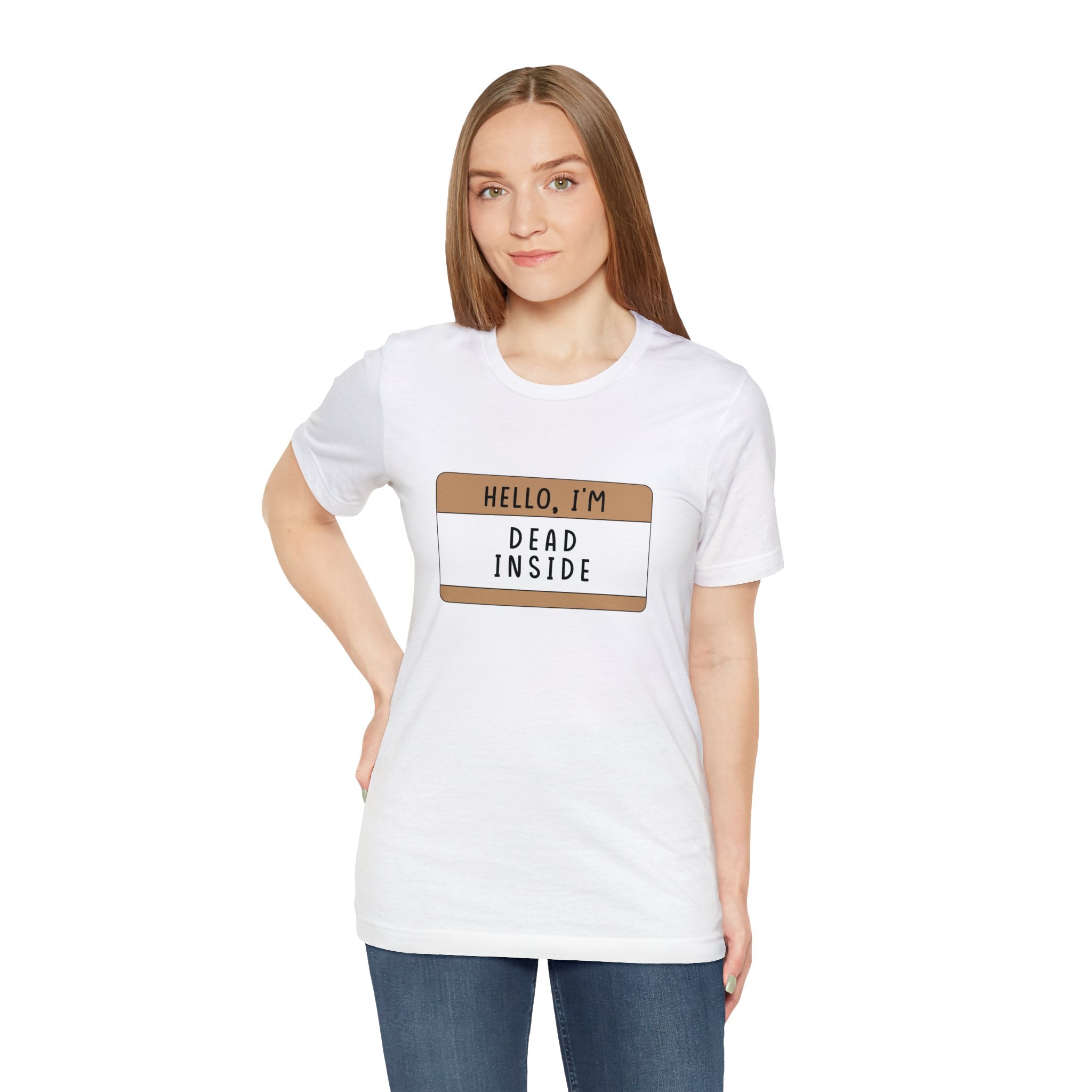A woman in a white Hello, I'm Dead Inside T-Shirt with a quirky design that reads "hello, i'm dead inside," standing against a plain background.