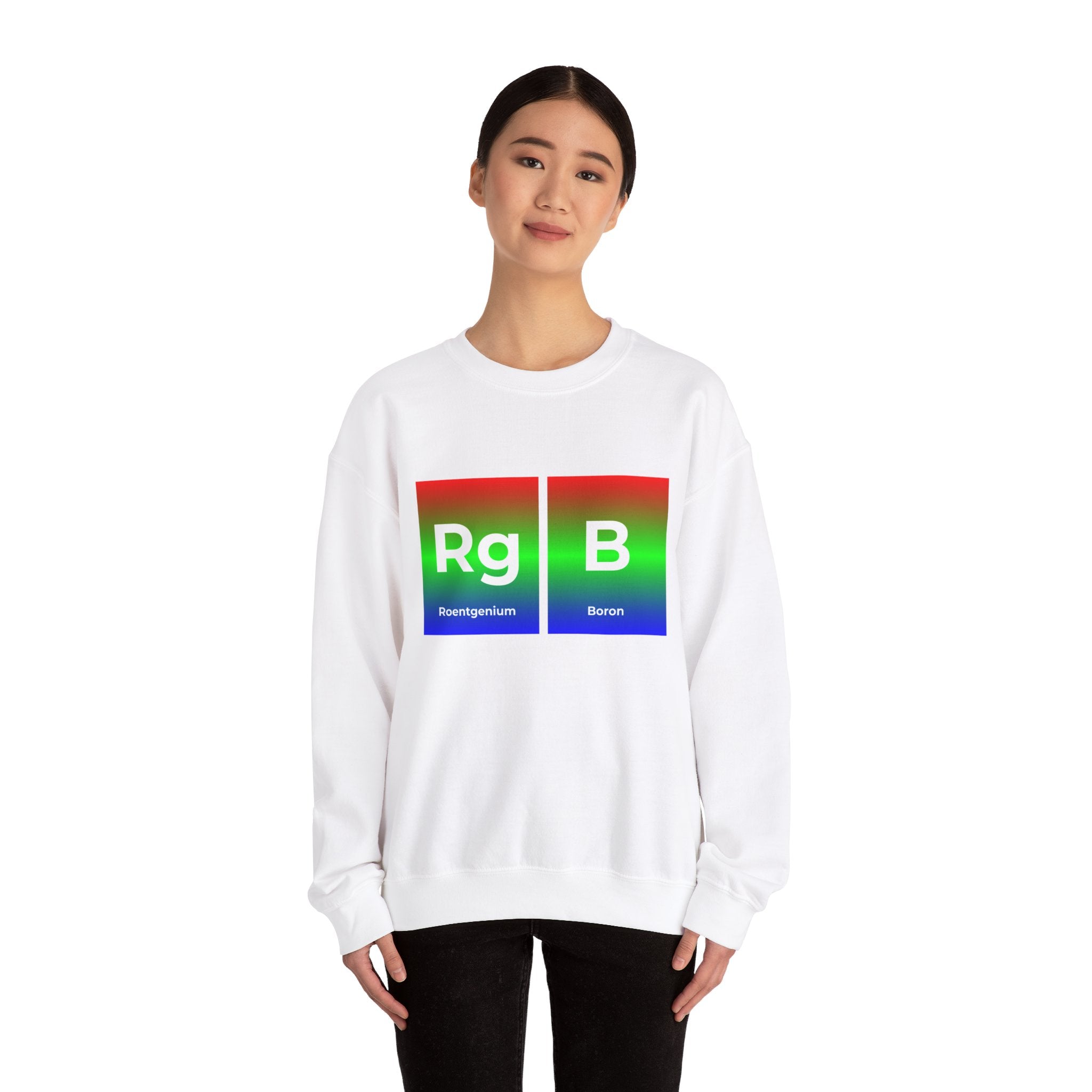 Person wearing a cozy white sweatshirt, perfect for comfort lovers, featuring colorful periodic table elements labeled "Roentgenium" and "Boron" displayed as "Rg" and "B". This RG-B - Sweatshirt combines style and science seamlessly.